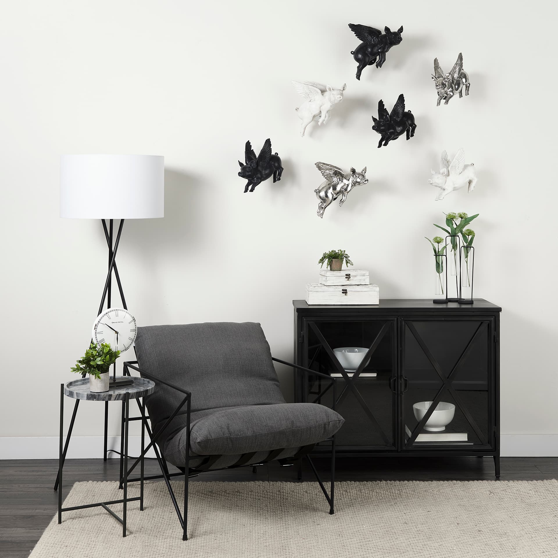 Stella 17L x 17W Gray Round Marble Top W/Black Base Accent Table — in a styled room