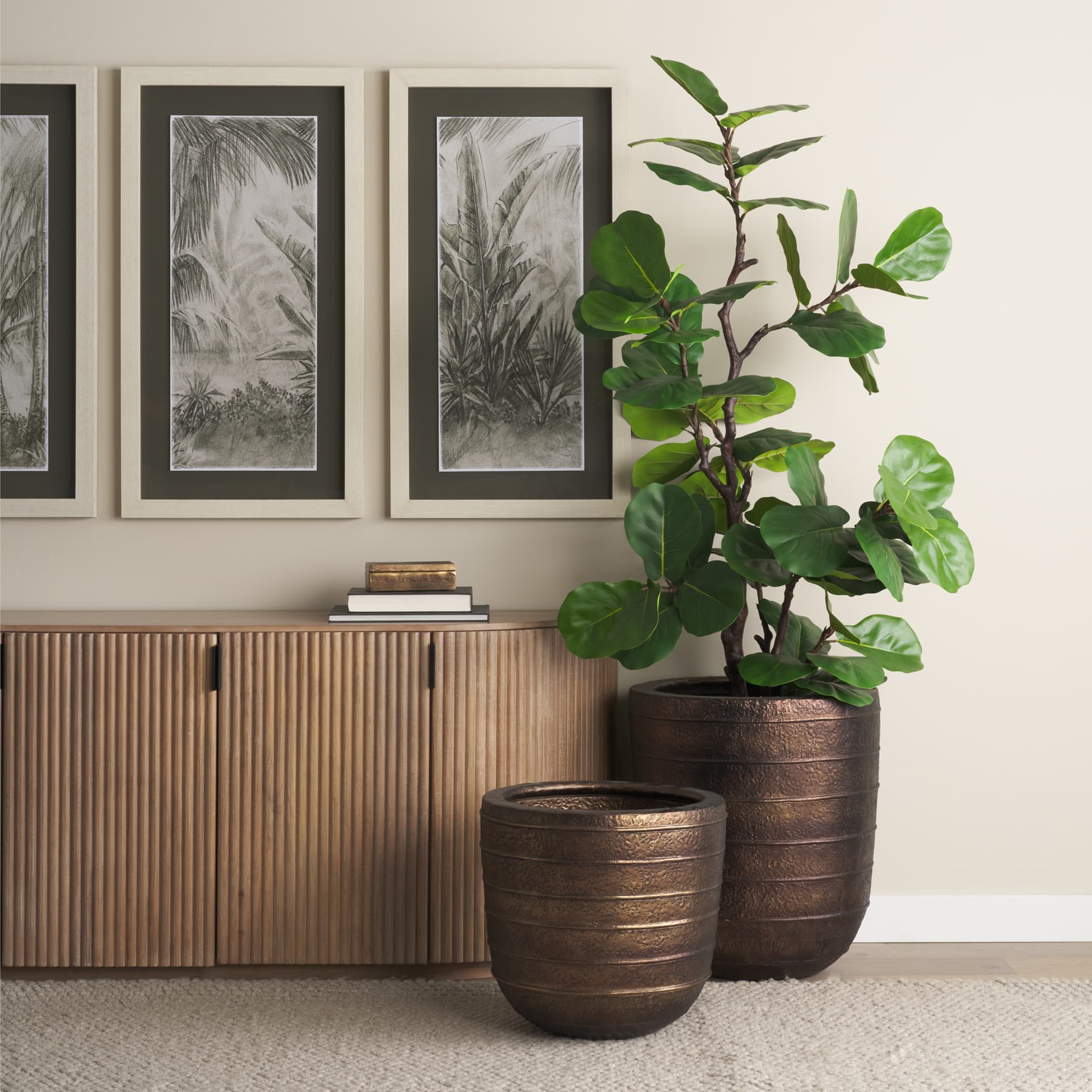 Aivana Extra Large Antiqued Gold Metal Floor Vase — in a styled room