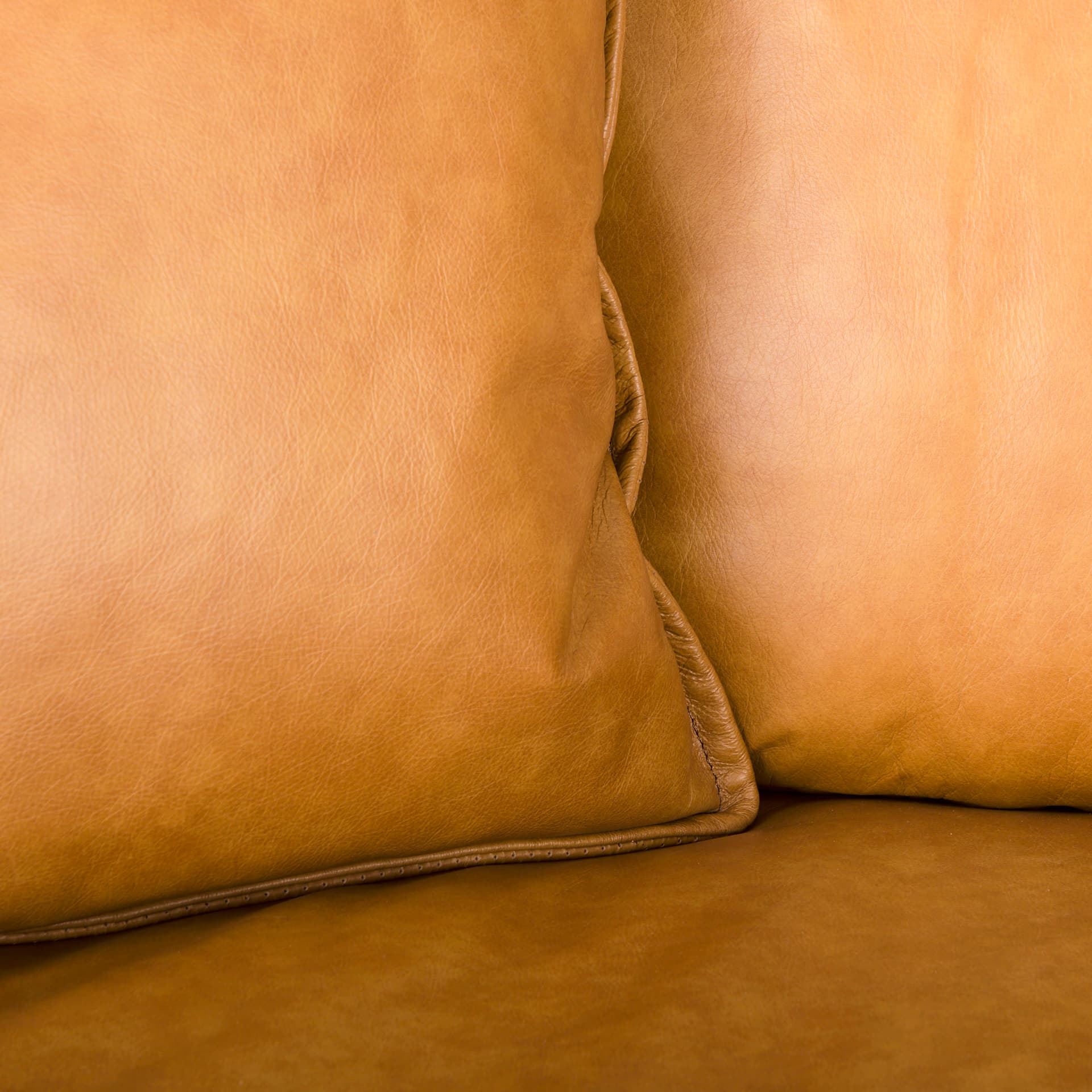 D'Arcy 111"L x 70"D x 33"H Tan Leather Right Chaise Sectional — product photograph