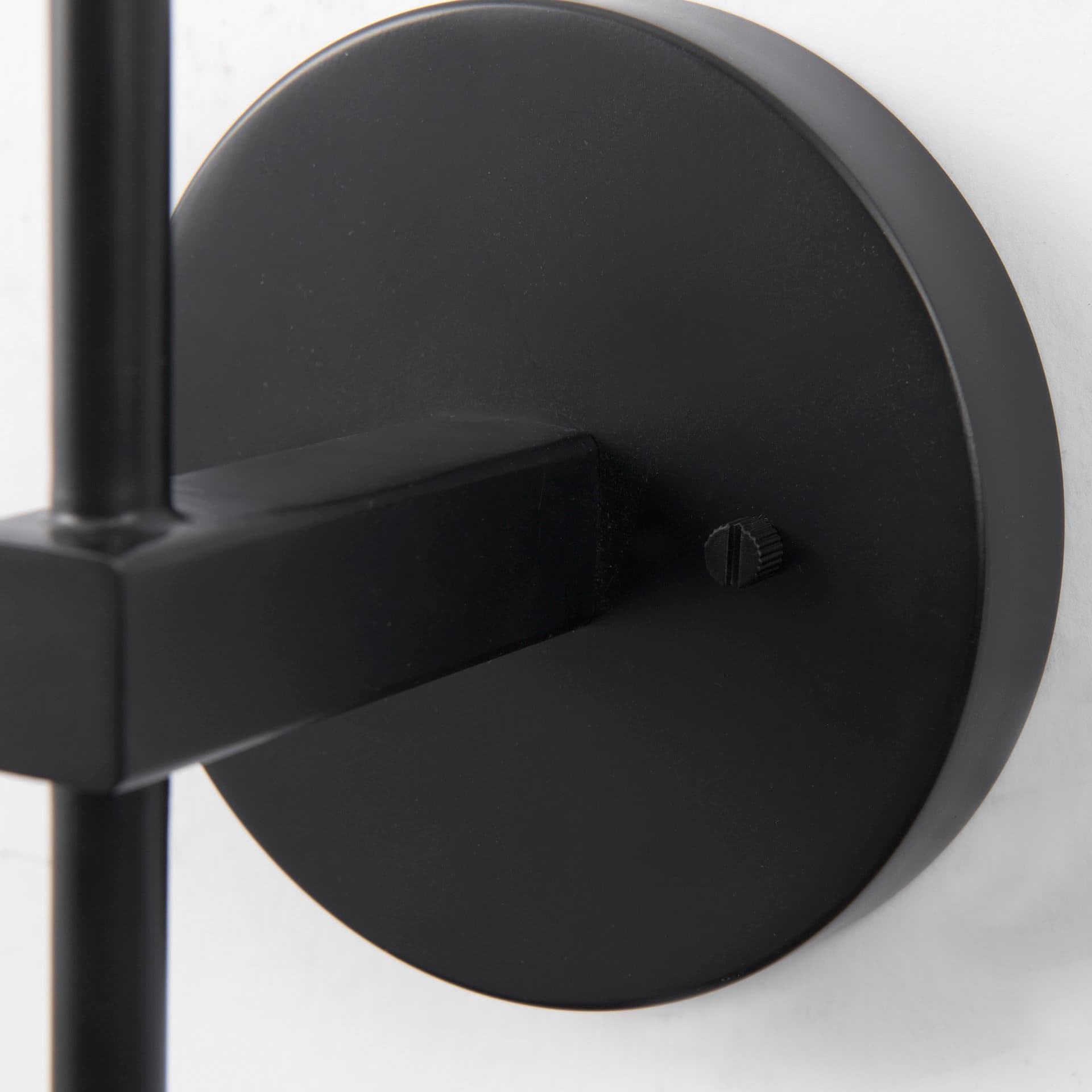 Clyde 6.0L x 8.0W x 37.0H Matte Black W/Glass Round Wall Sconce — product photograph