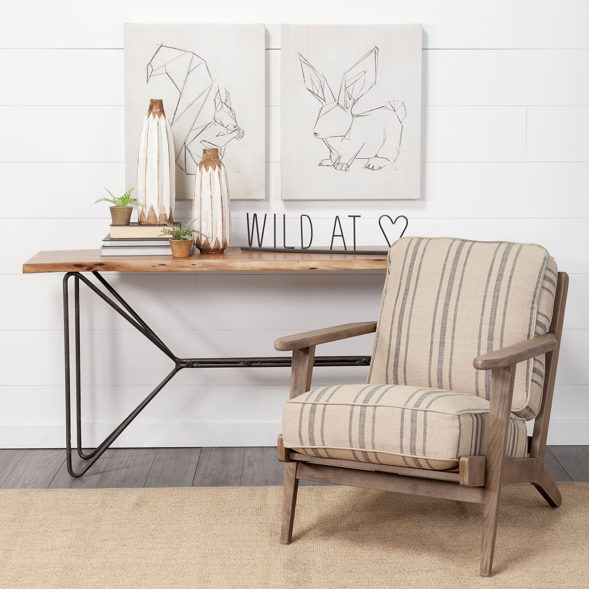 Wild at Heart 24L x 1W Black Metal Sign — in a styled room