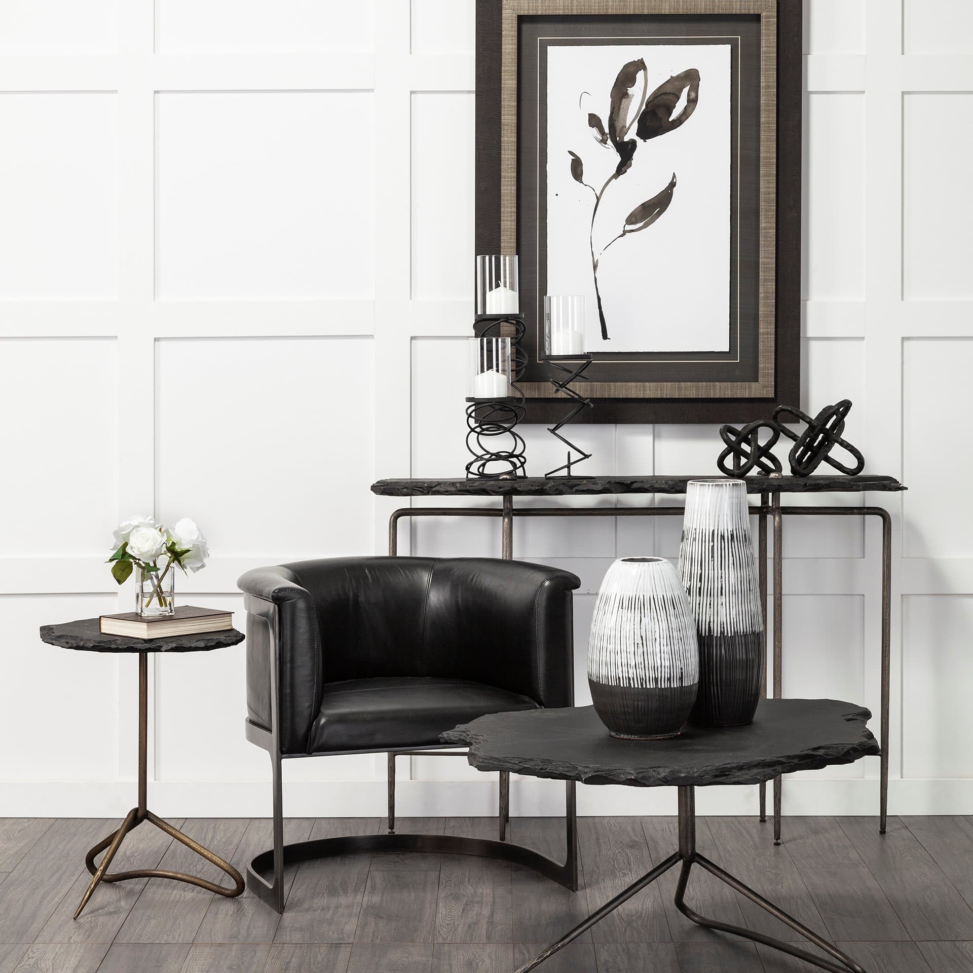 Omega II Medium Black Metal Stacked Ring Table Candle Holder — in a styled room