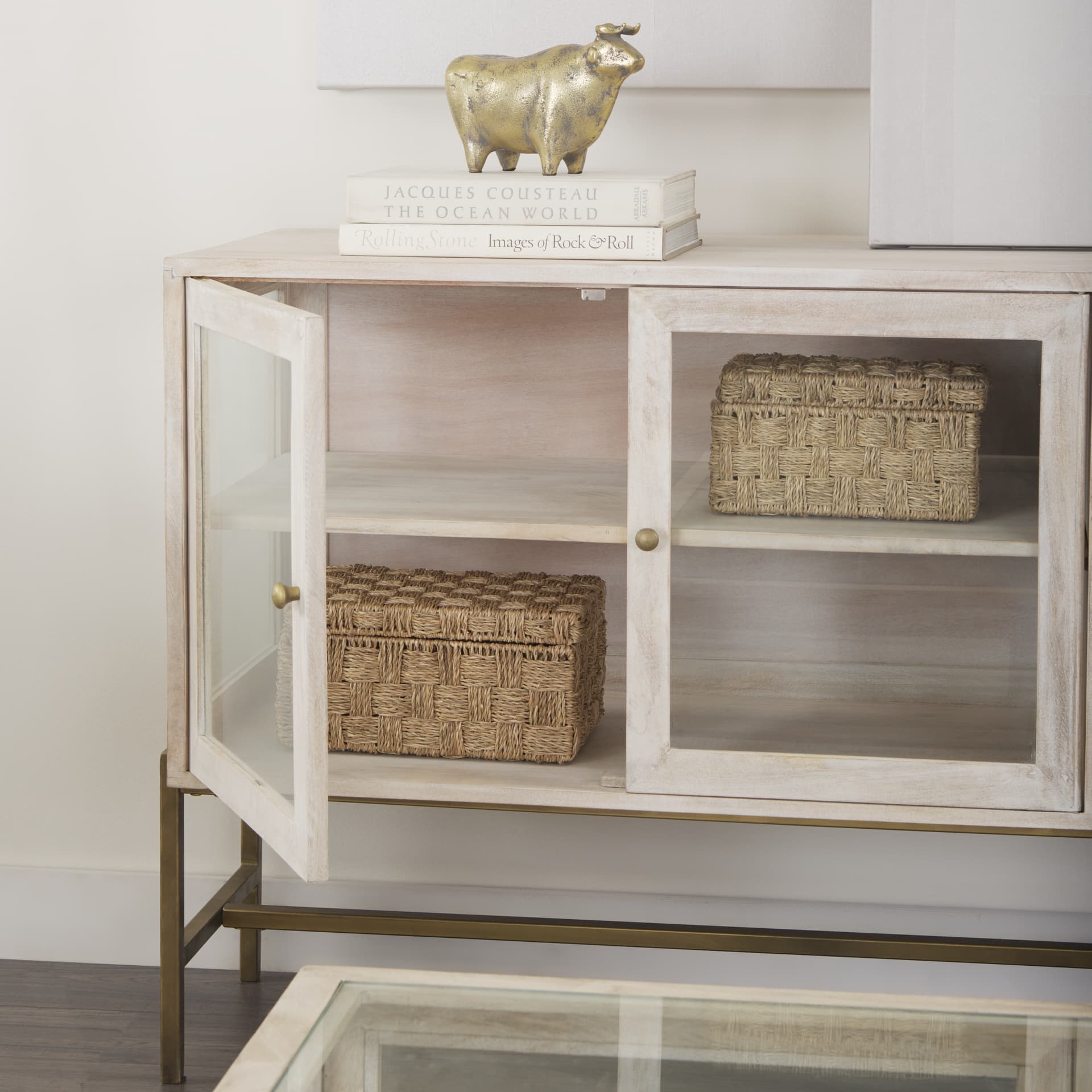 Arelius 36L x 18W x 32H White Wood, Gold Metal Base w/ 2 Glass Doors Accent Cabinet — in a styled room
