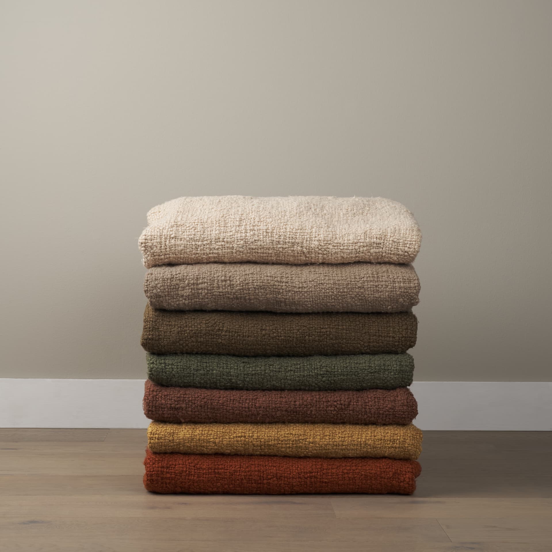 Kambal Evergreen Woven Cotton Throw Blanket — in a styled room