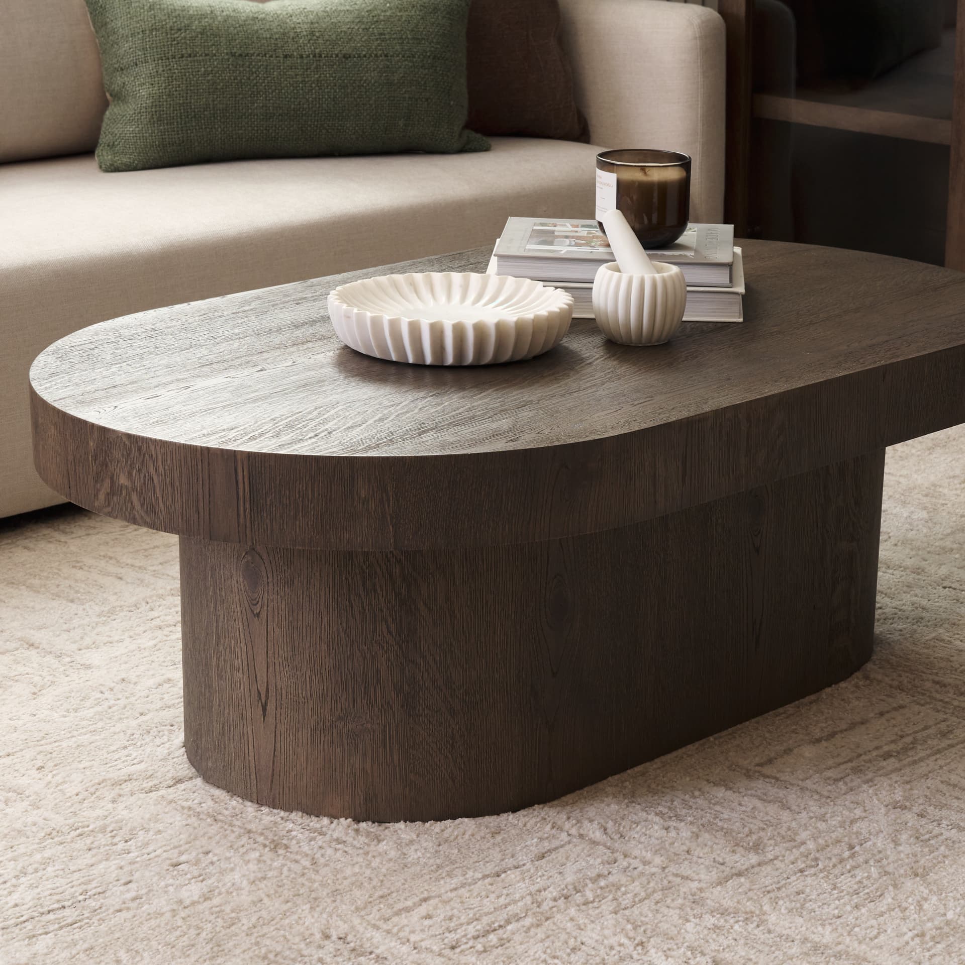 Lyonne Oblong Medium Brown Oak Wood Coffee Table — in a styled room