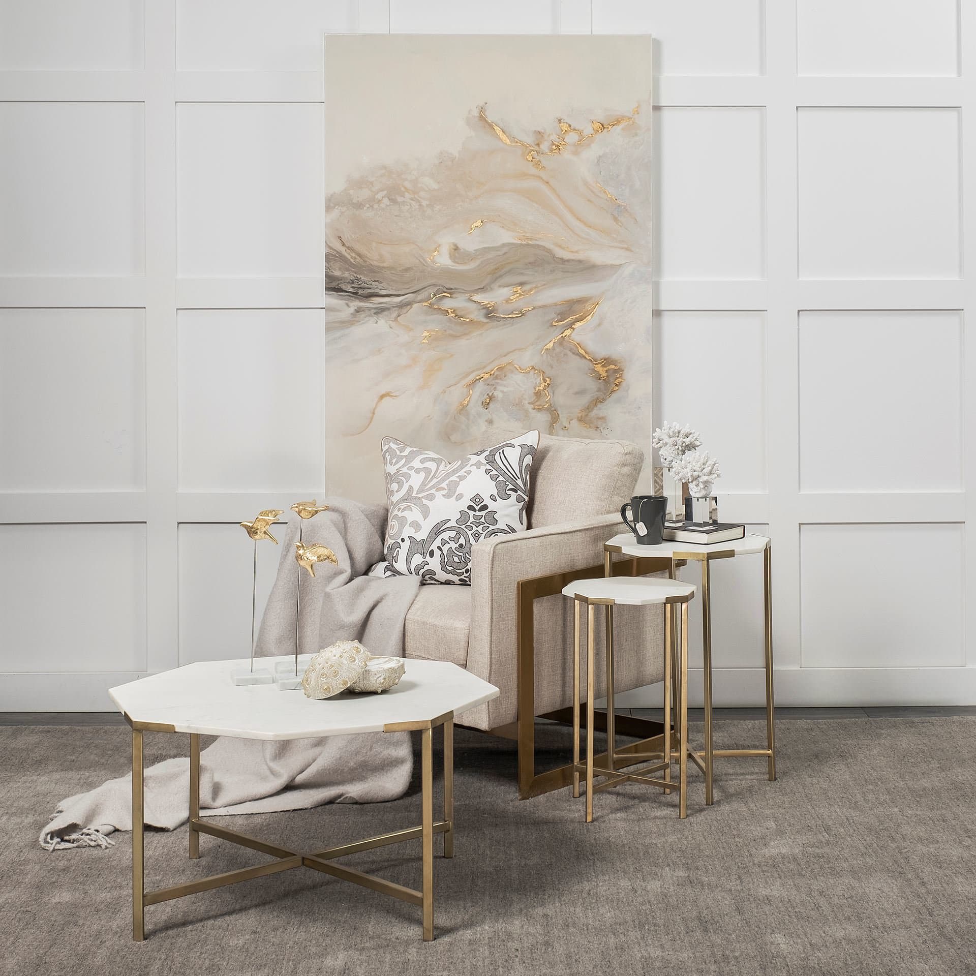Vincent 33" Octagonal White Marble Tabletop w/ Gold Metal Base Coffee Table — in a styled room