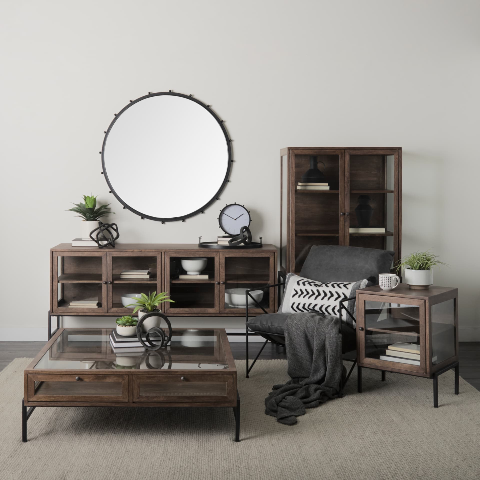 Arelius 70L x 18.75W x 32H Medium Brown, Black Metal Base w/ 4 Glass Door Cabinets Sideboard — in a styled room
