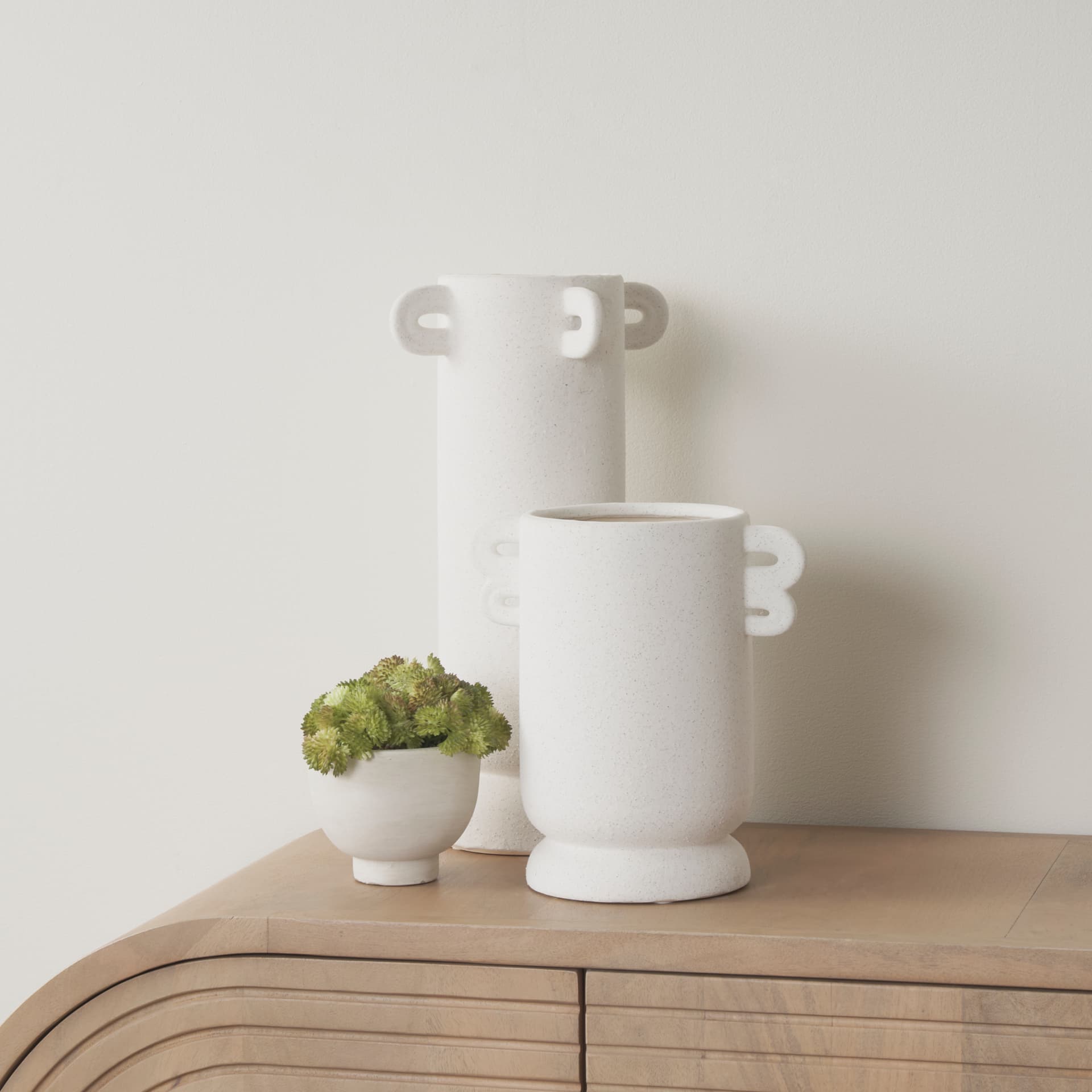 Dylan Tall Textured Off White w/ Handles Ceramic Vase — in a styled room
