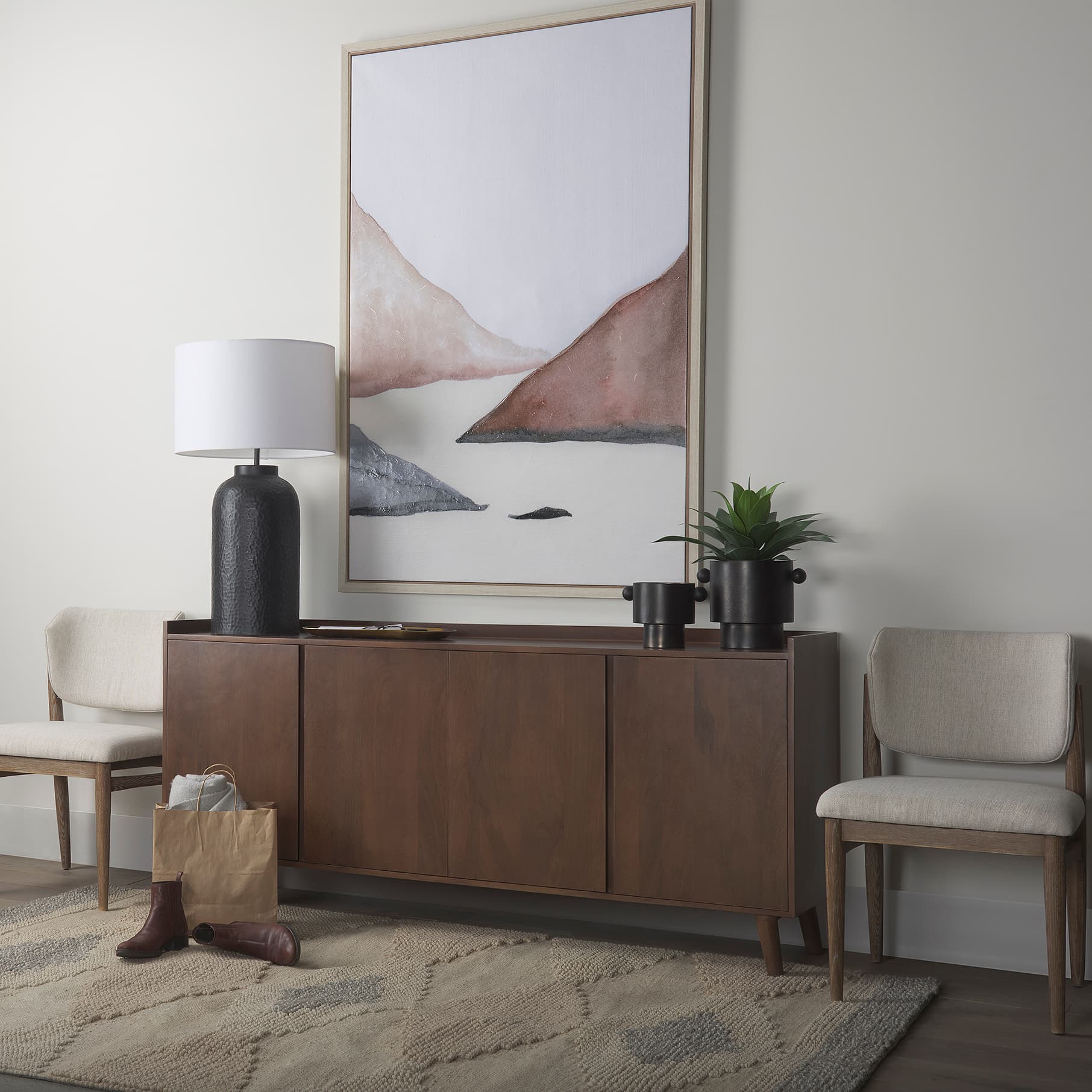 Lillie Medium Brown Wood 4 Door Tray Top Sideboard — in a styled room