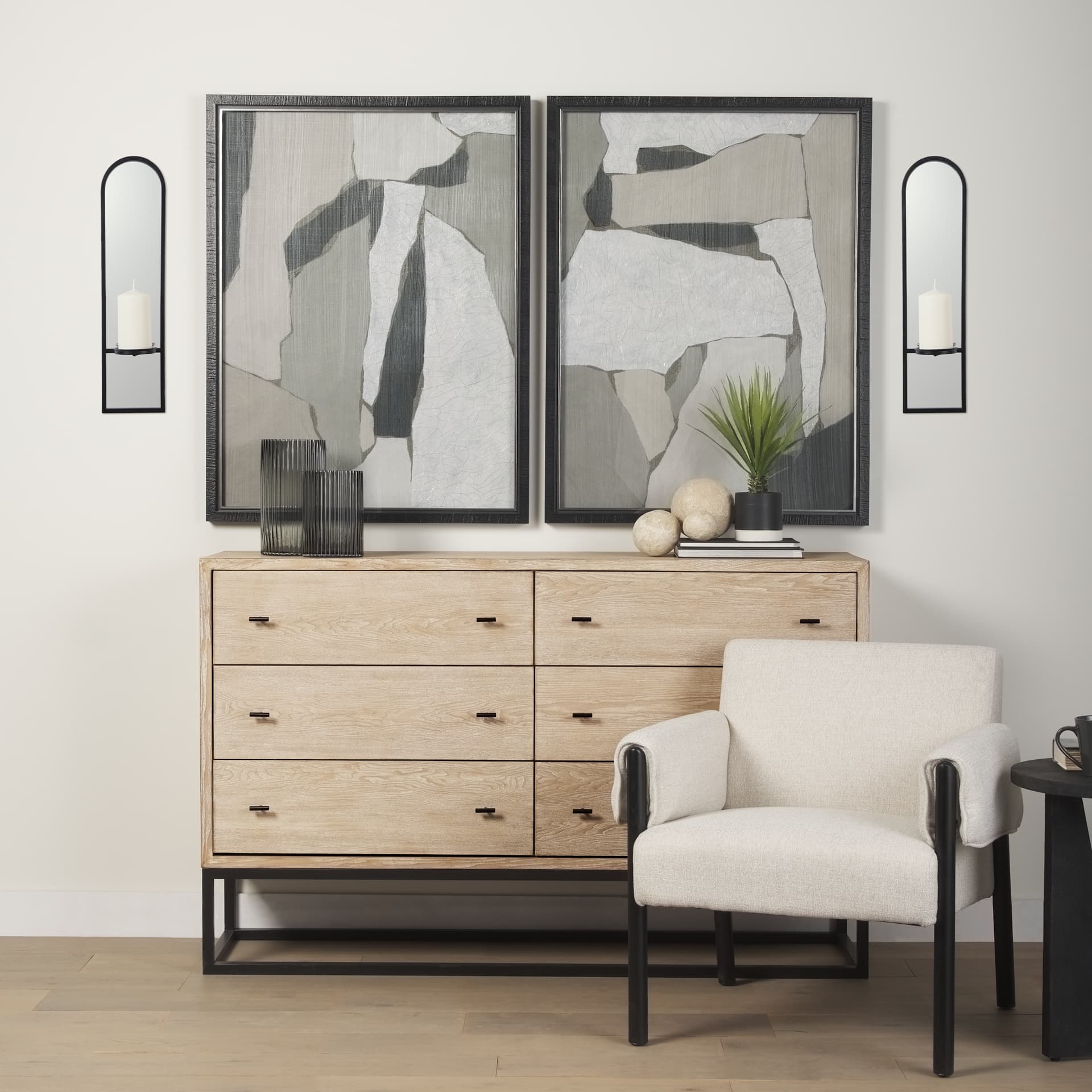 Evianna 7L x 7W x 25H Mirrored W/Black Metal Frame Wall Candle Holder — in a styled room