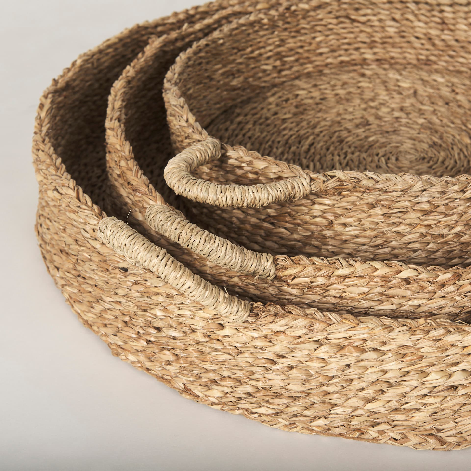 Ulana Set of 3 Round Nesting Seagrass Trays w/ Loop Handles — product photograph
