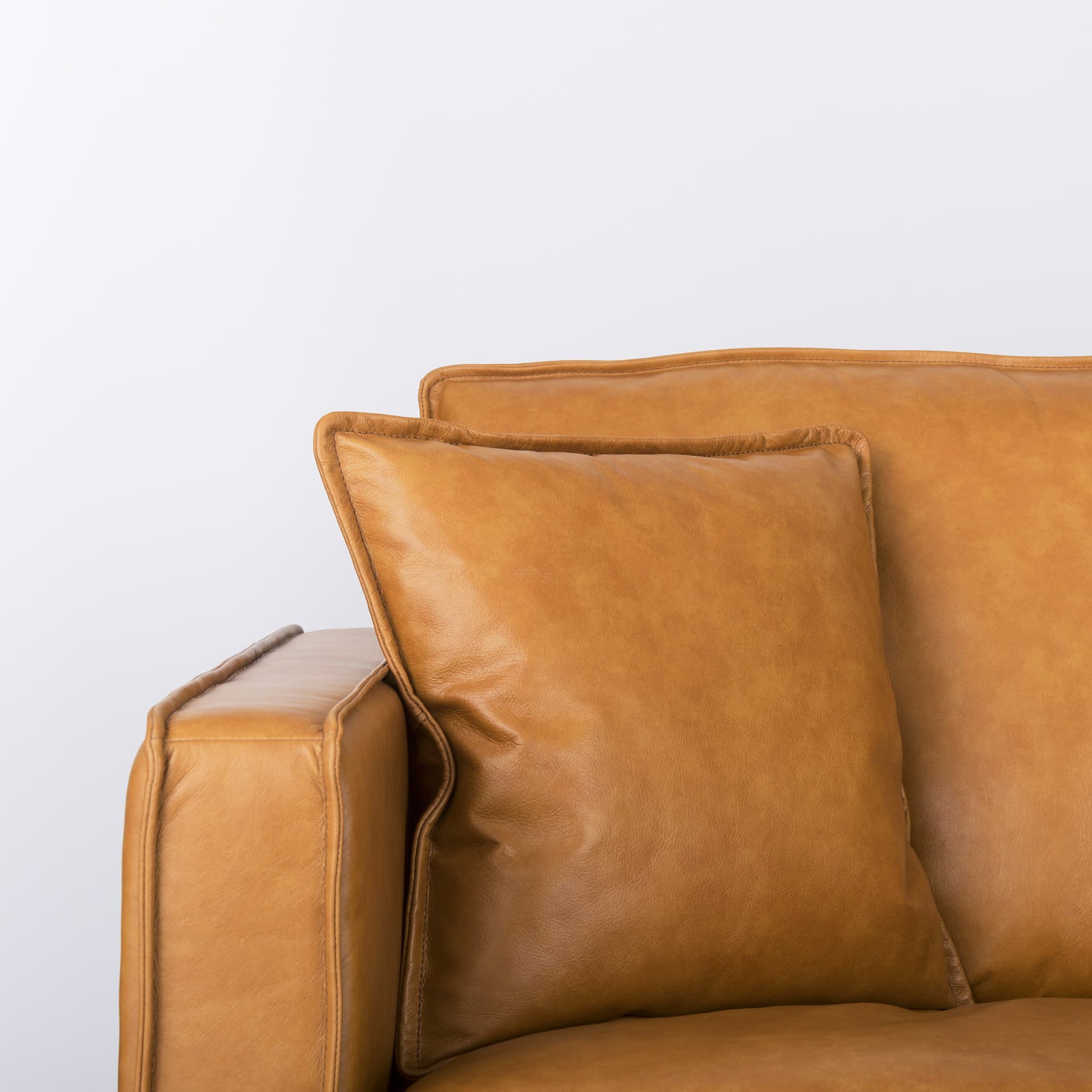 D'Arcy 111"L x 70"D x 33"H Tan Leather Right Chaise Sectional — product photograph