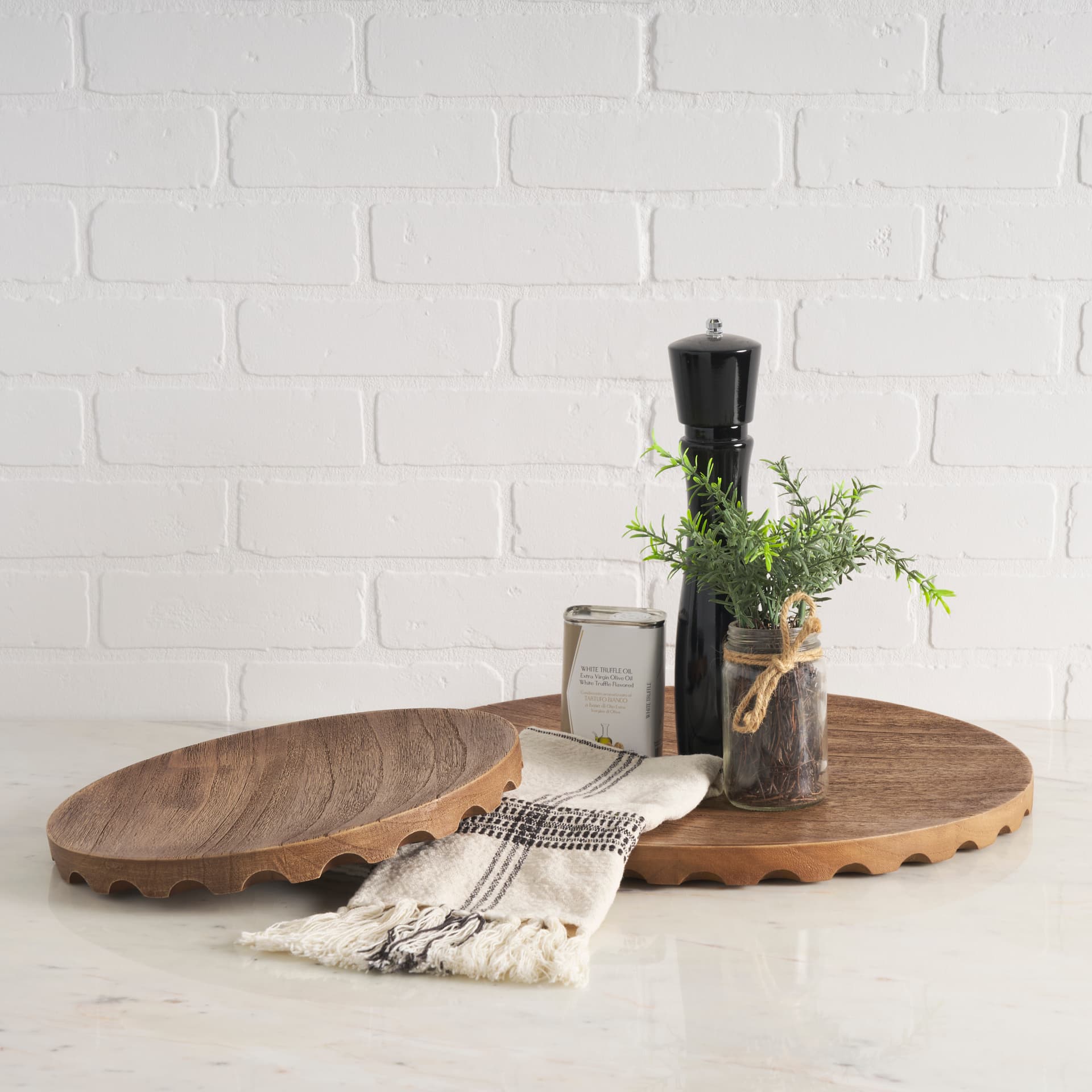 Waverly Round Light Brown Wood Scalloped Edged Trays — in a styled room