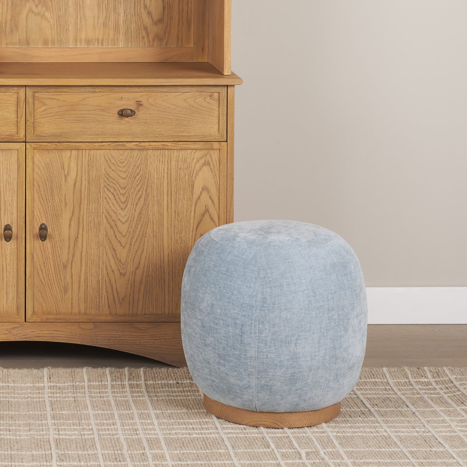 Siren French Blue Fabric w/ Brown Ash Wood Round Accent Stool — in a styled room
