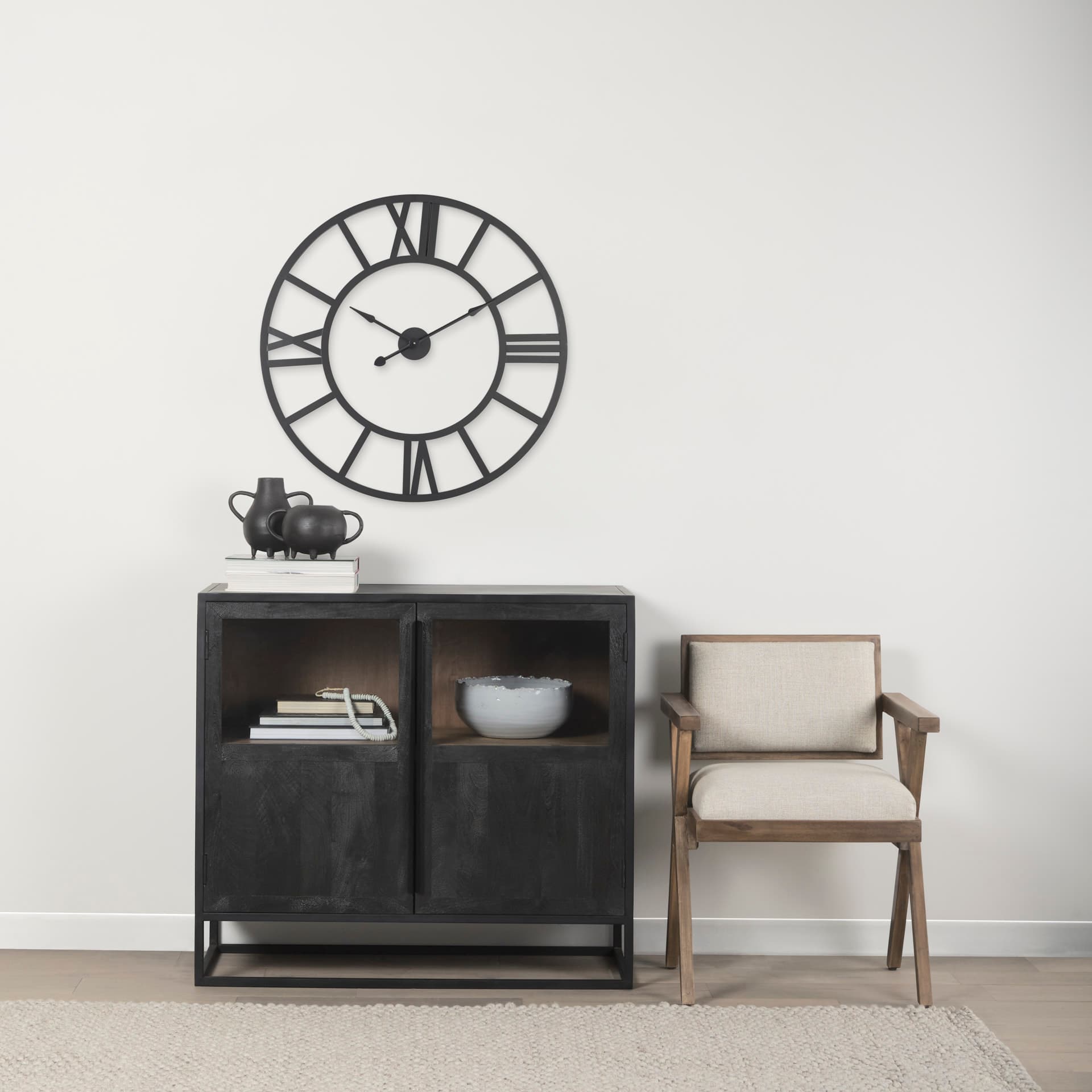 Stoke 30" Round Black Iron Wall Clock — in a styled room