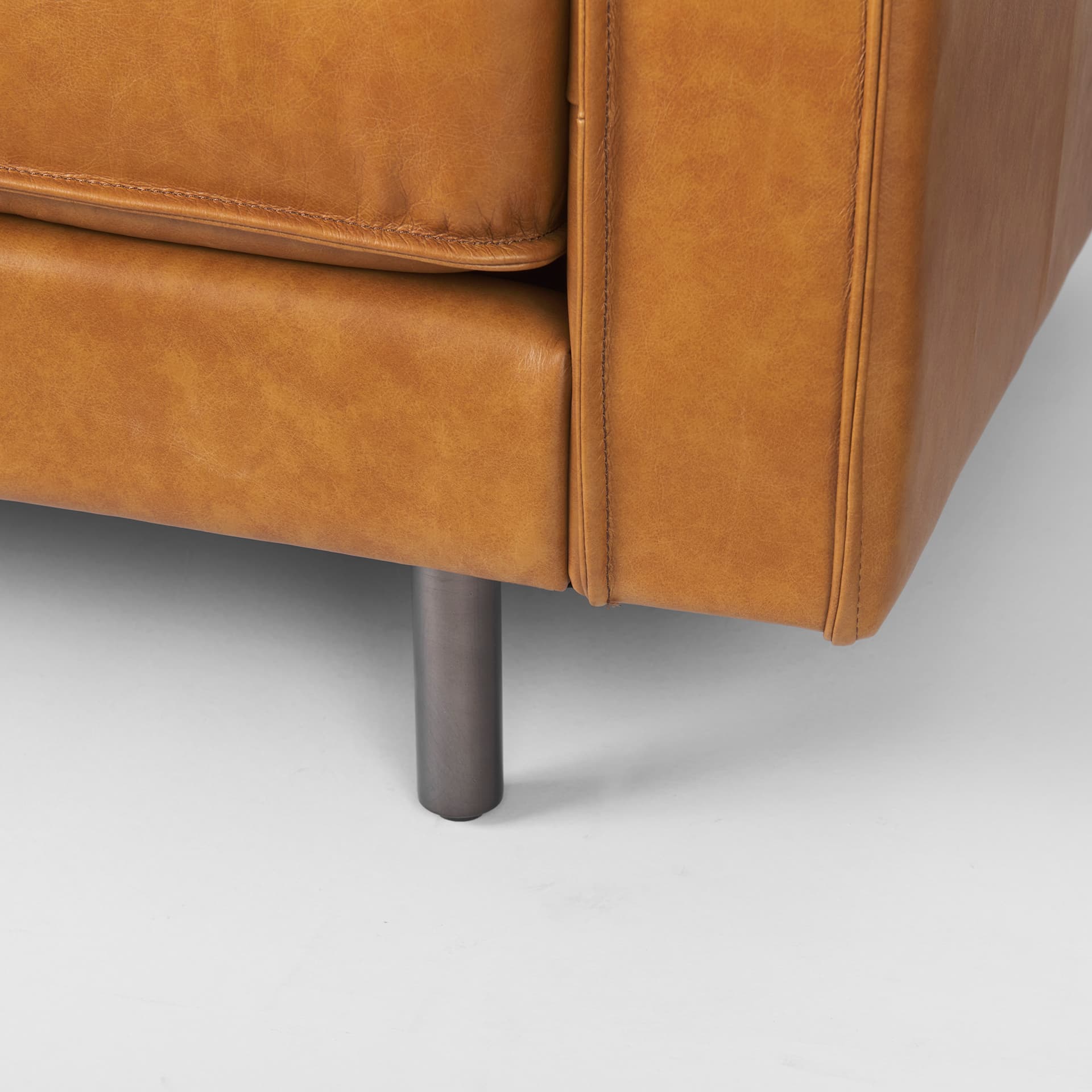 D'Arcy 111"L x 70"D x 33"H Tan Leather Left Chaise Sectional — product photograph