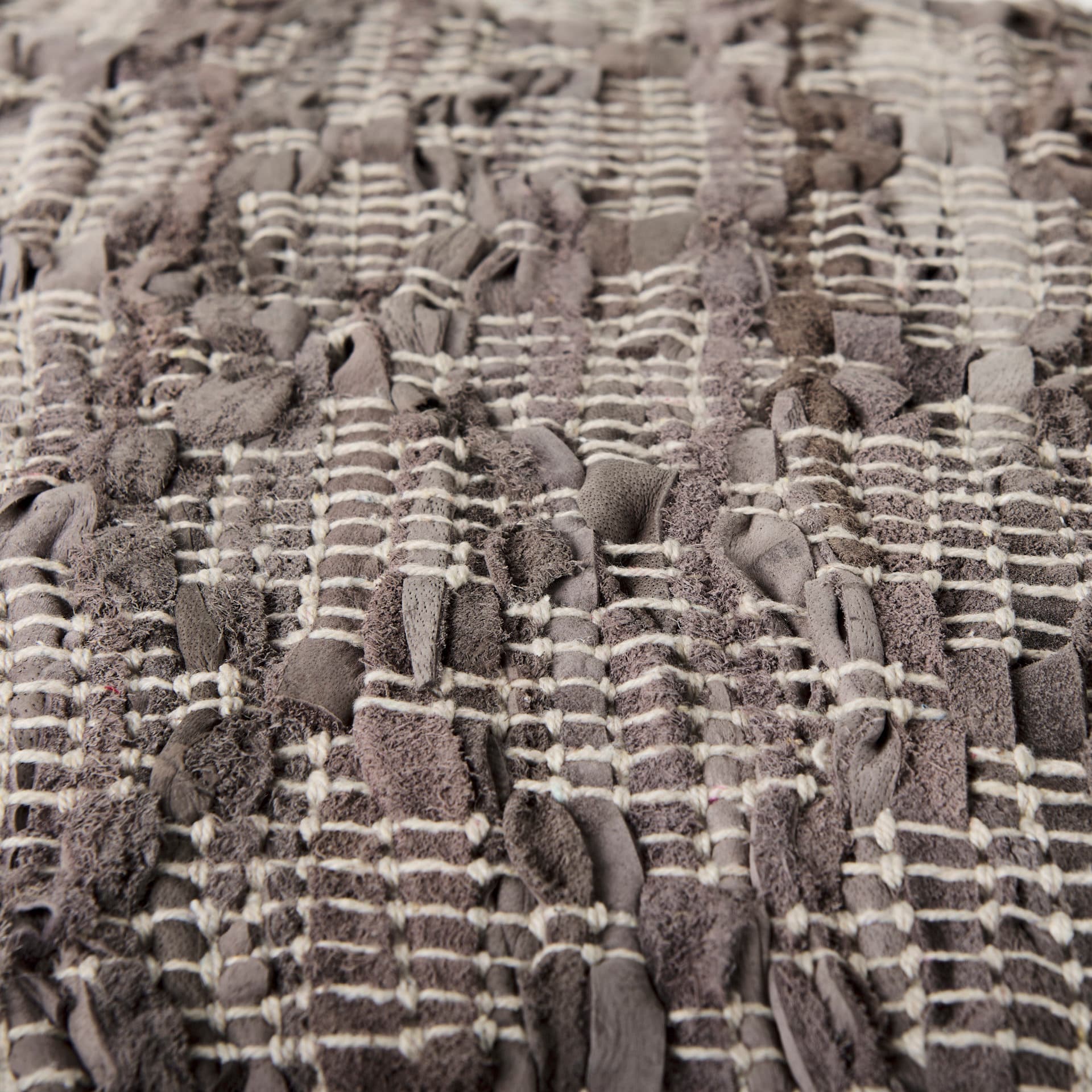 Falguni 16.0L x 16.0W x 16.0H Gray Leather and Cotton Patterned Pouf — product photograph