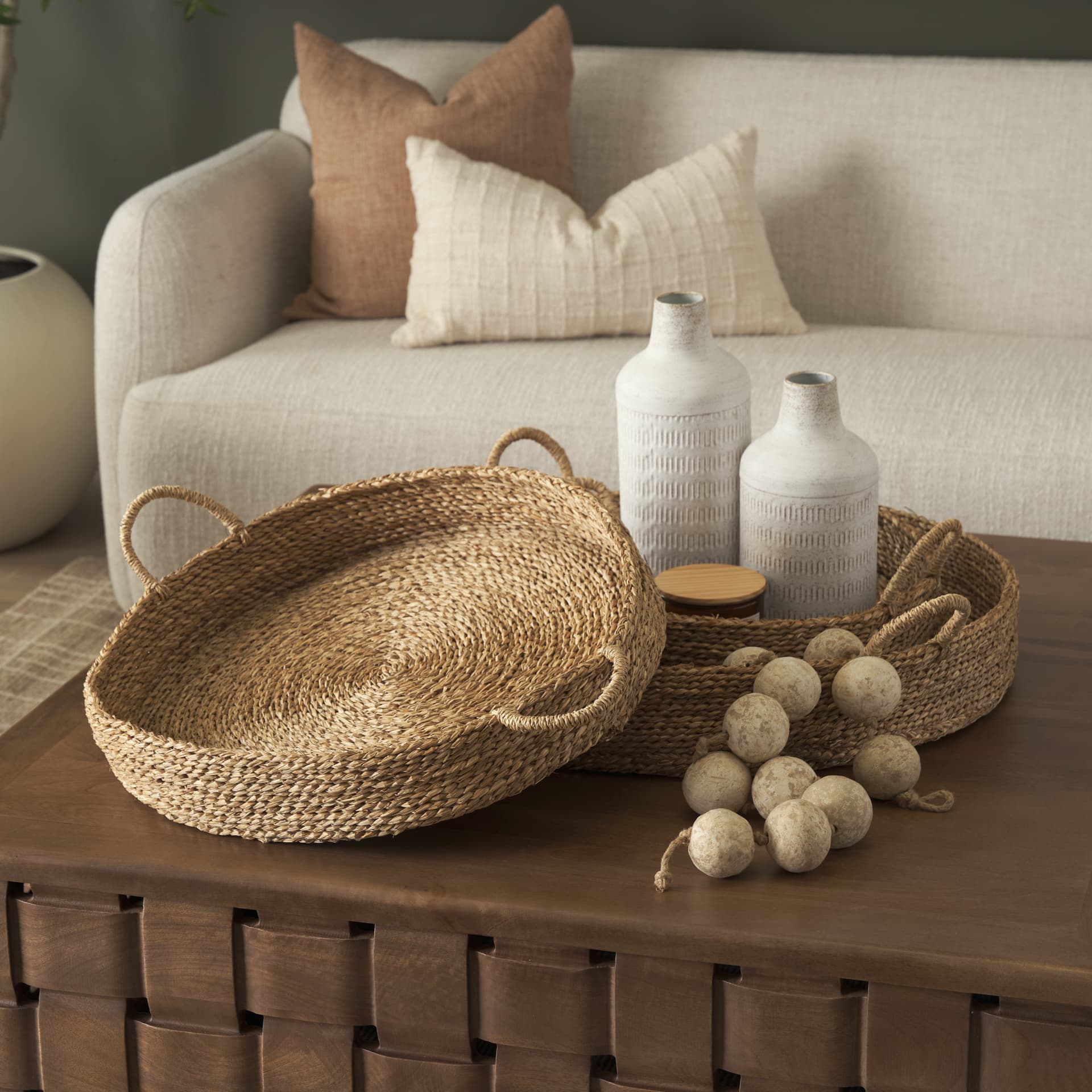 Ulana Set of 3 Round Nesting Seagrass Trays w/ Loop Handles — in a styled room