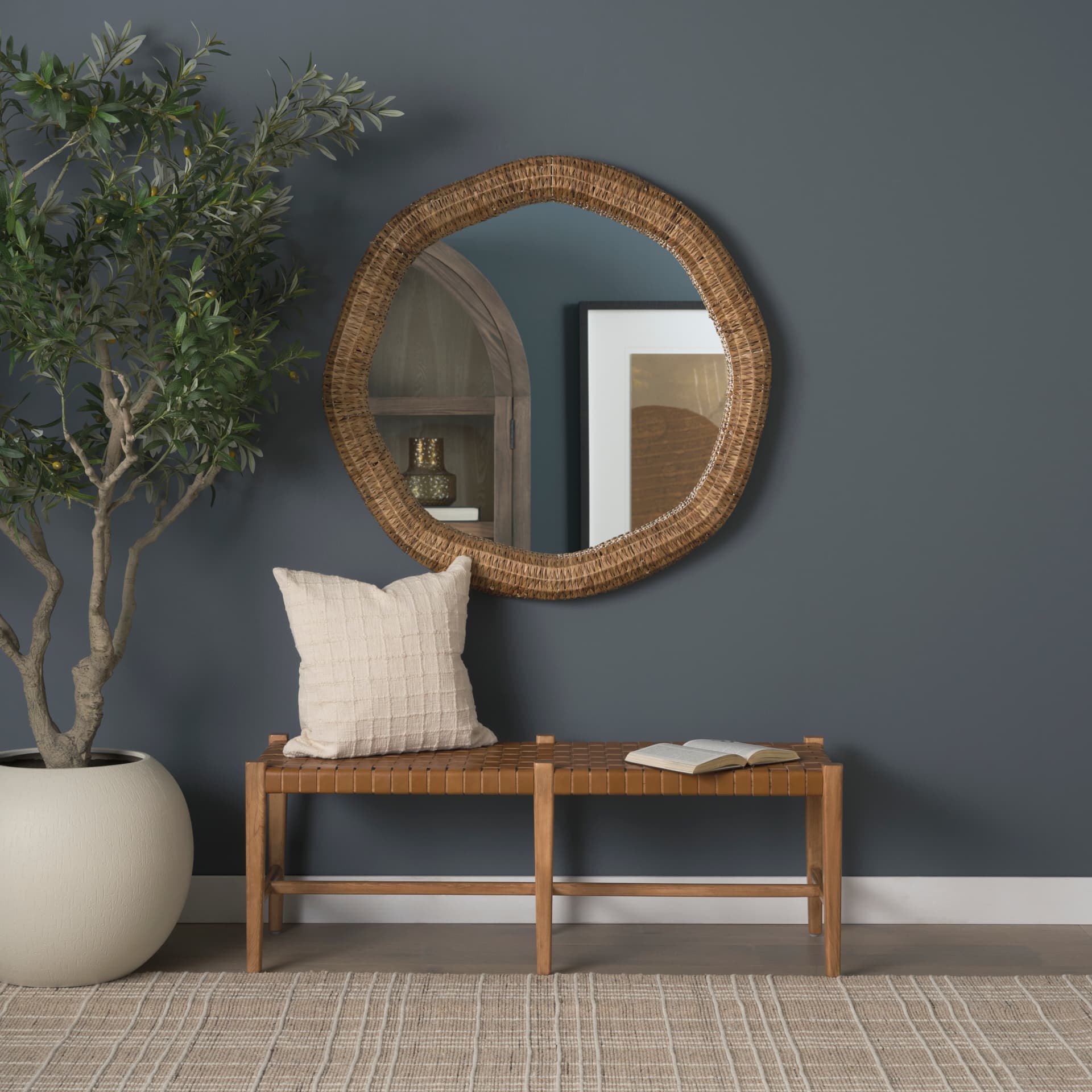 Warrick 42" Woven Water Hyacinth Mirror — in a styled room