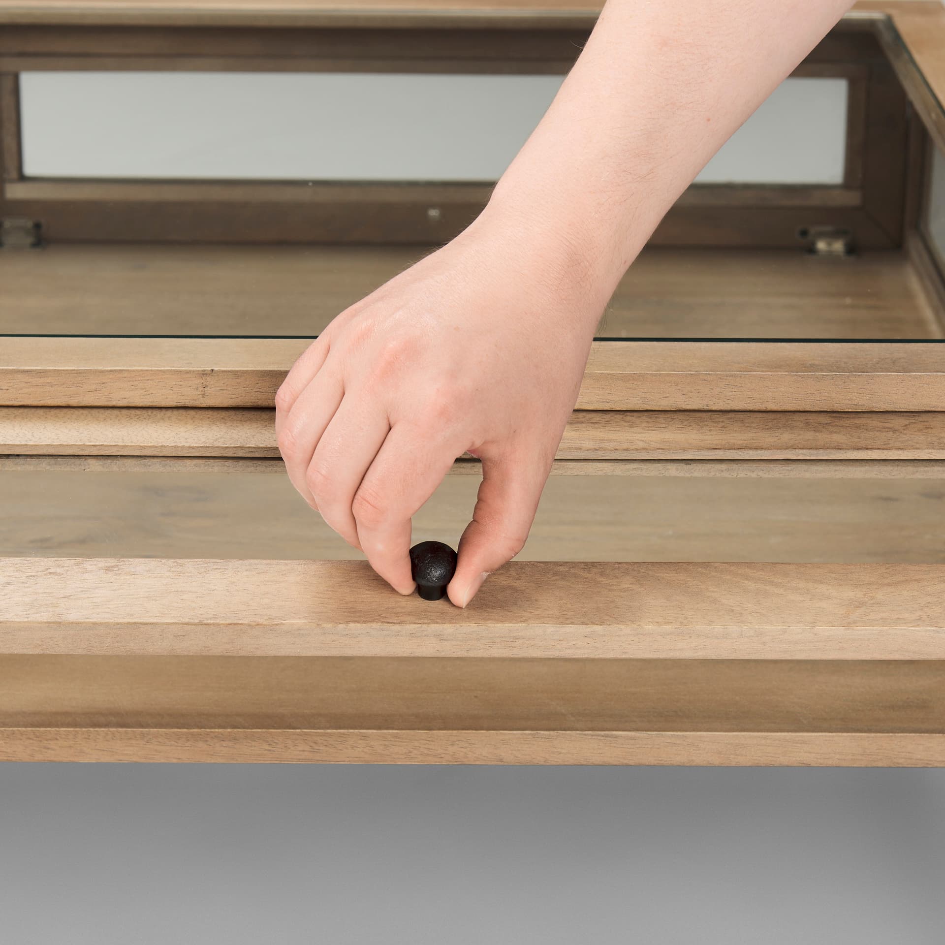 Arelius 49.5"L Rectangular Light Brown Wood w/ Black Metal Base Display Coffee Table — product photograph