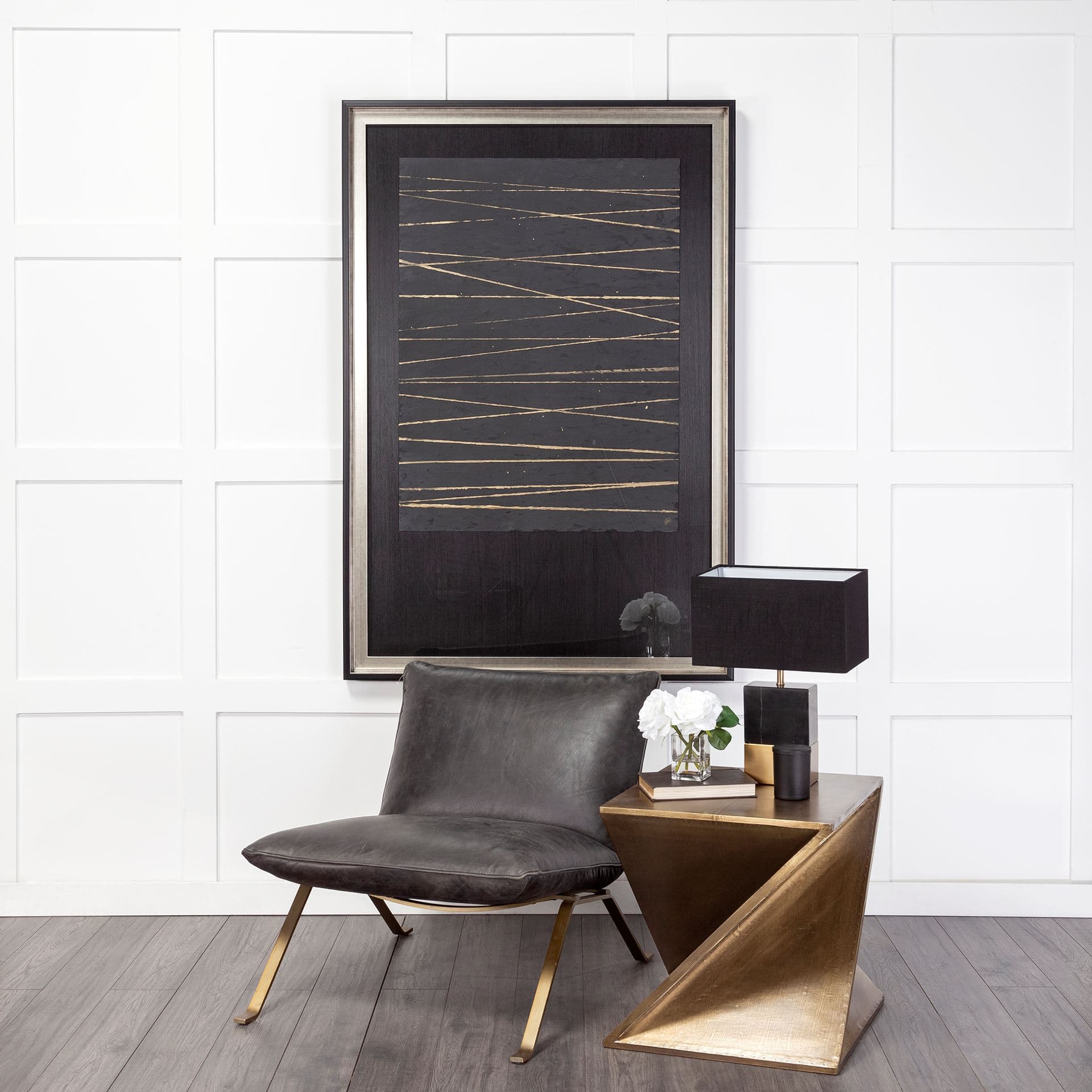 Flavelle II Black Leather Cushion Seat and Solid Iron Base Accent Chair — in a styled room