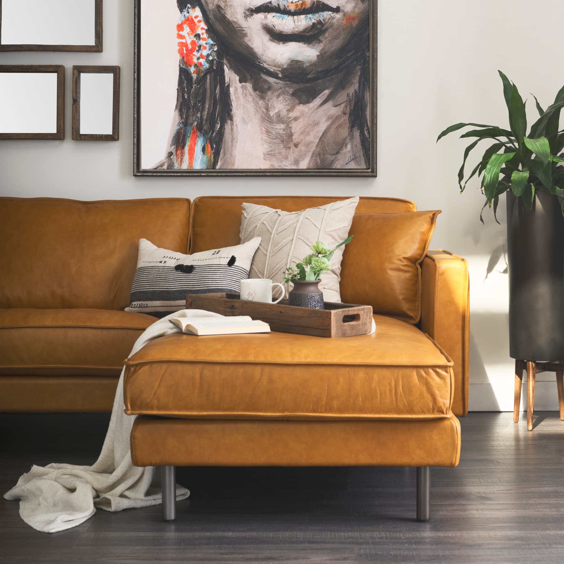 D'Arcy 111"L x 70"D x 33"H Tan Leather Right Chaise Sectional — in a styled room