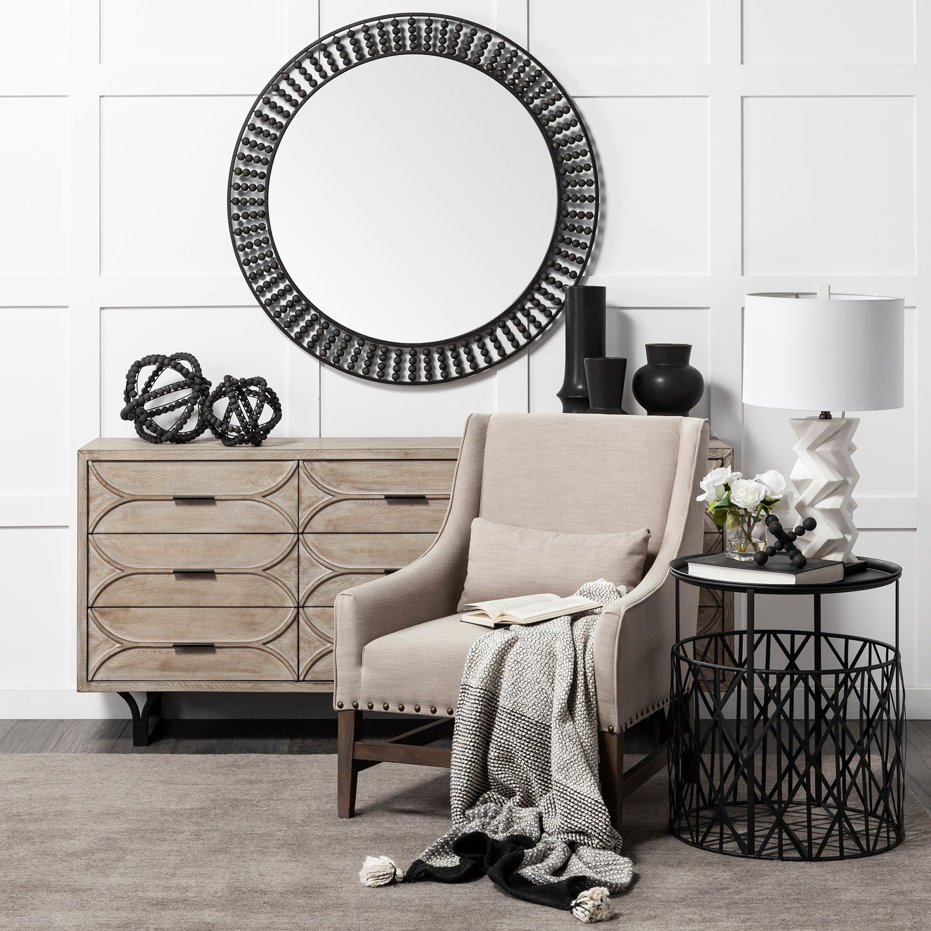 Claiborne 42" Round Black Metal Frame Mirror w/Wood Beads — in a styled room