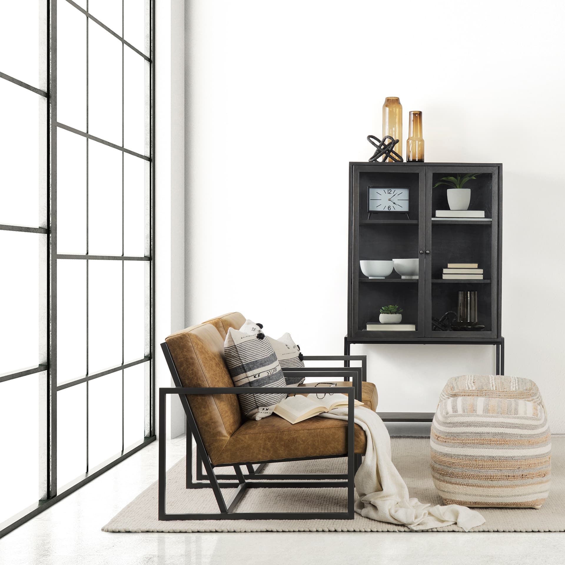 Arelius 36L x 18.75W x 63H Black-Brown Wood W/ Black Metal Base Display Cabinet — in a styled room