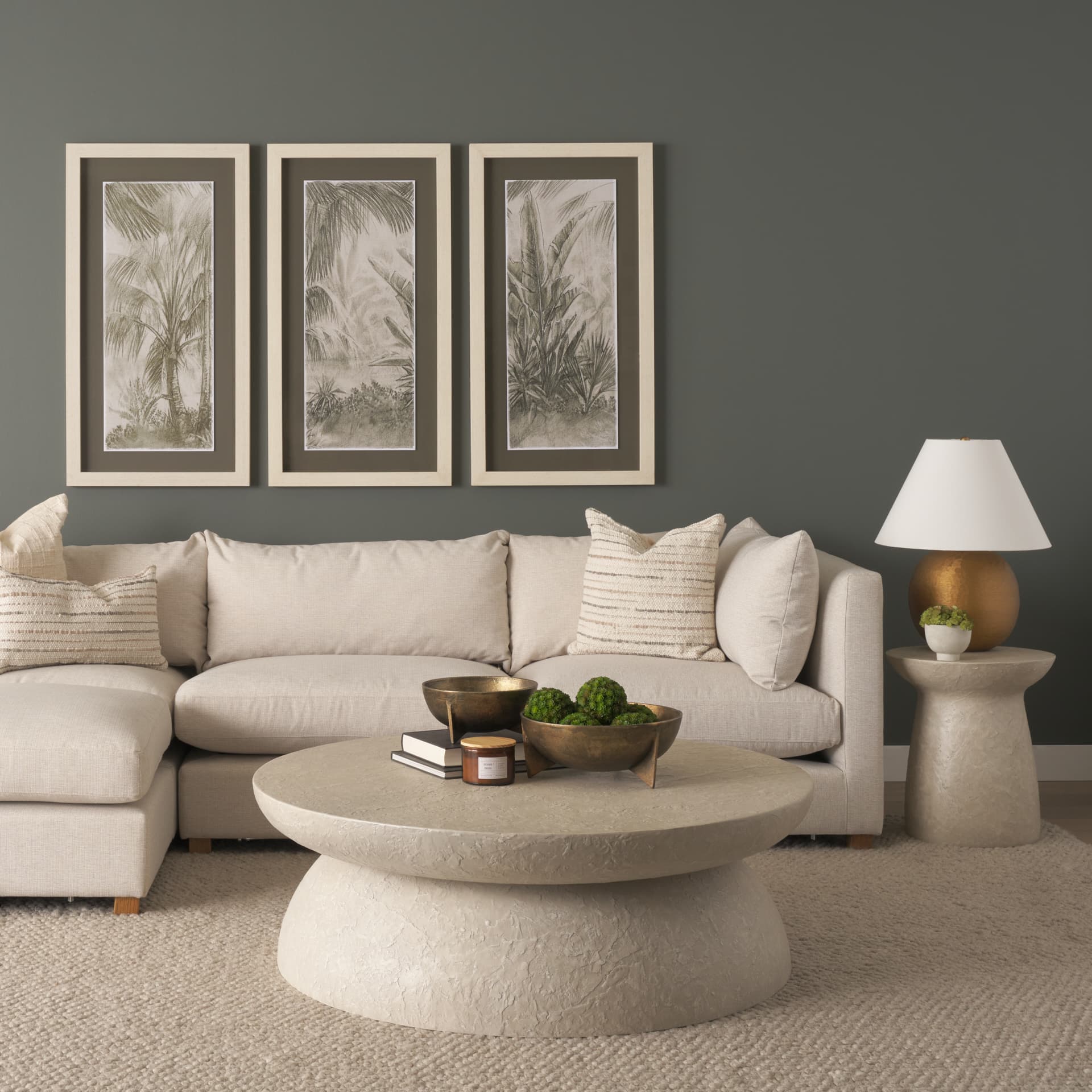 Mesa Round Stone Finish Pillar Accent Table — in a styled room