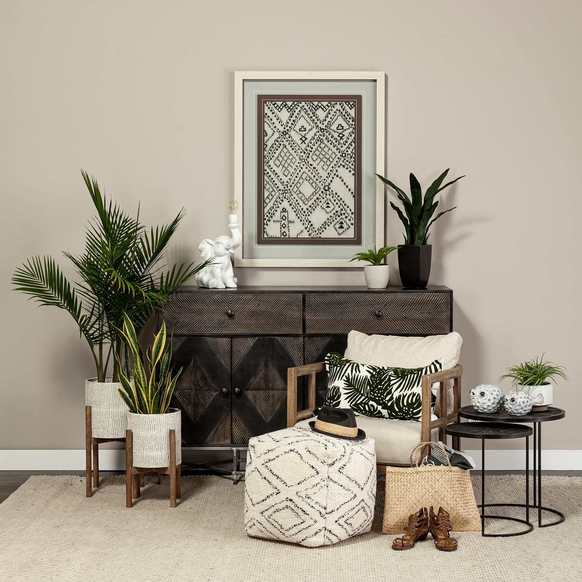 Chakra 19.7" Set of Two Round Dark Wood Top Black Frame Accent Tables — in a styled room