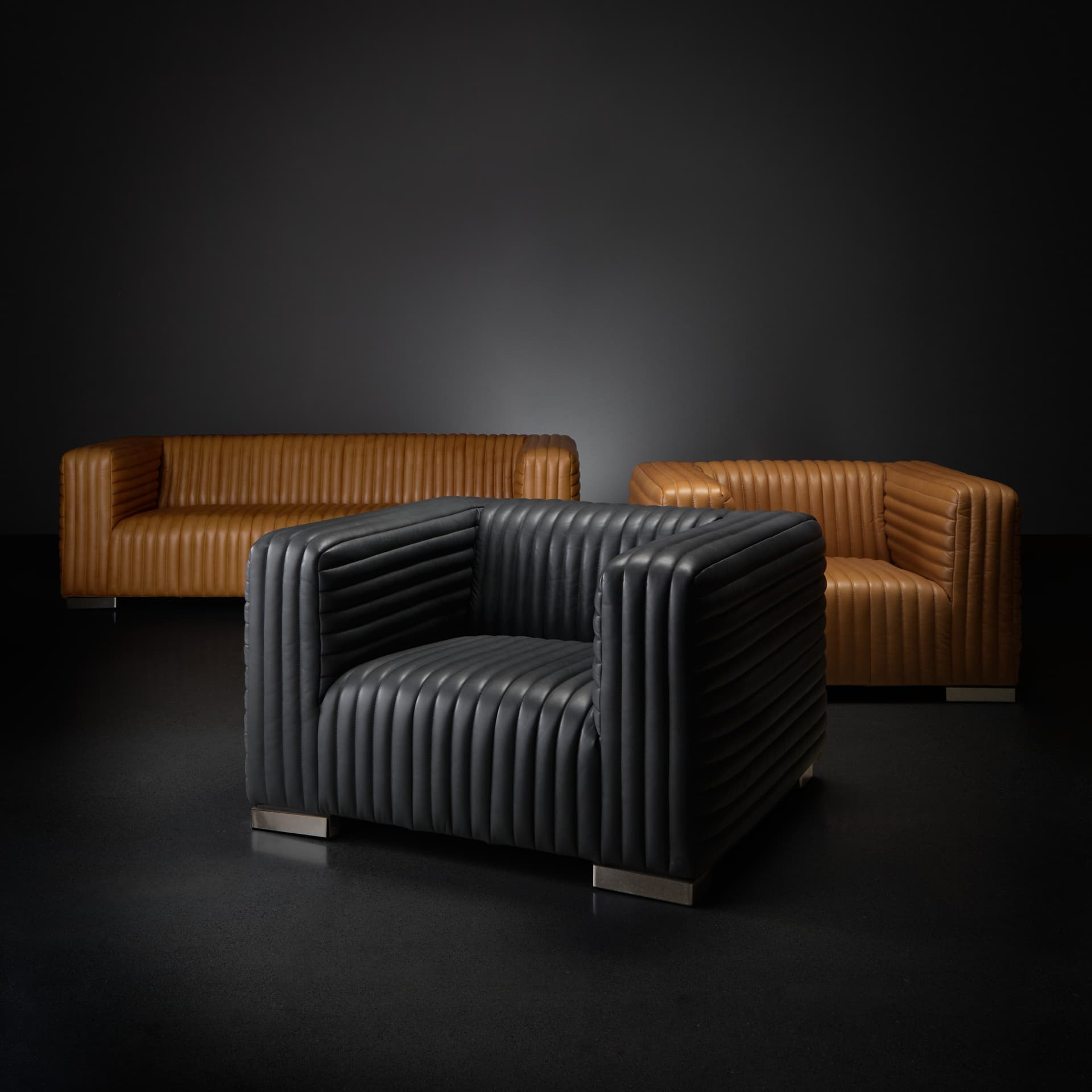 Ricciardo Black Leather Upholstered Arm Chair — in a styled room