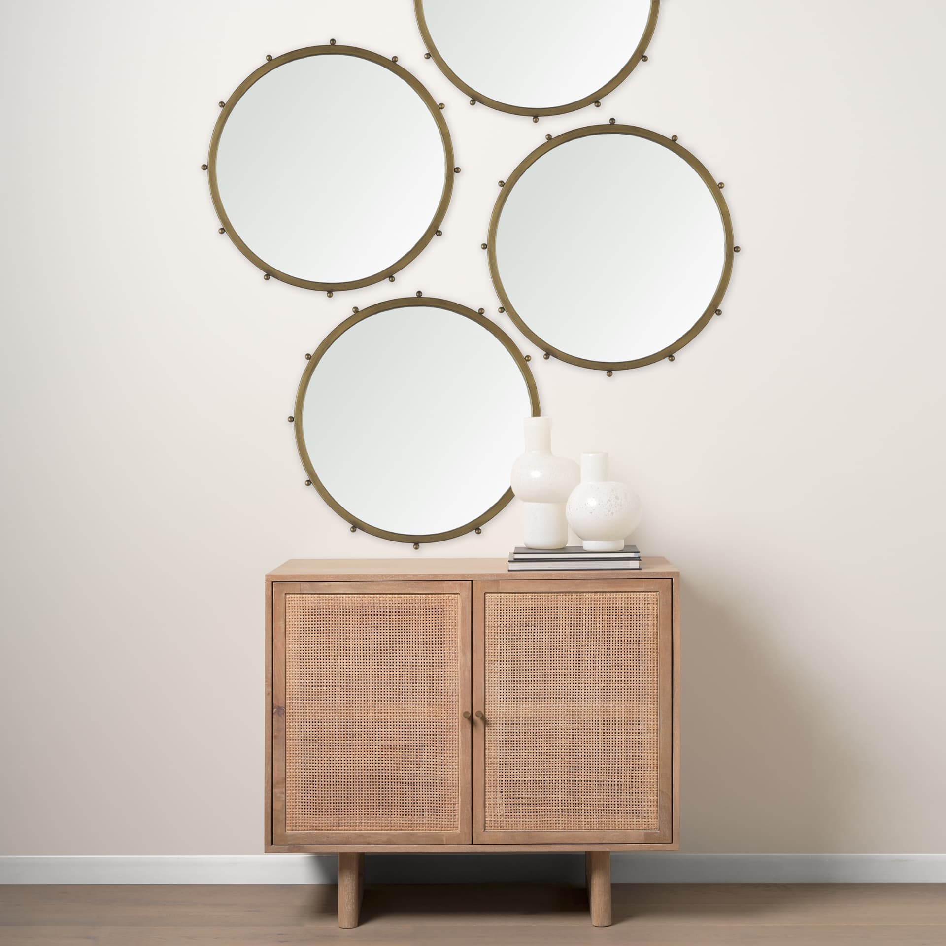 Elena I Small Gold Wall Mirror — in a styled room