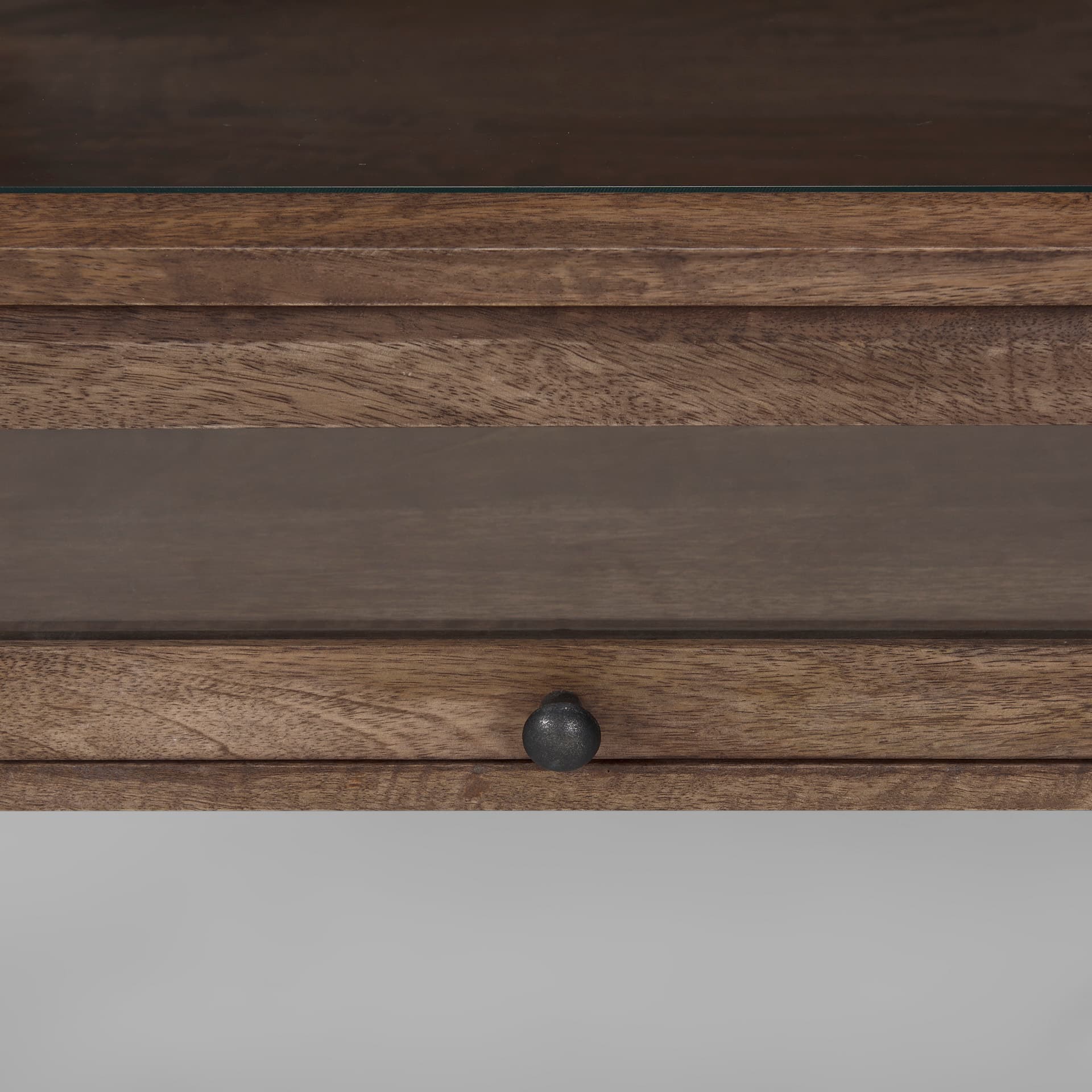 Arelius 49.5"L Rectangular Glass-Top Medium Brown Wood w/ Black Metal Base Display Coffee Table — product photograph