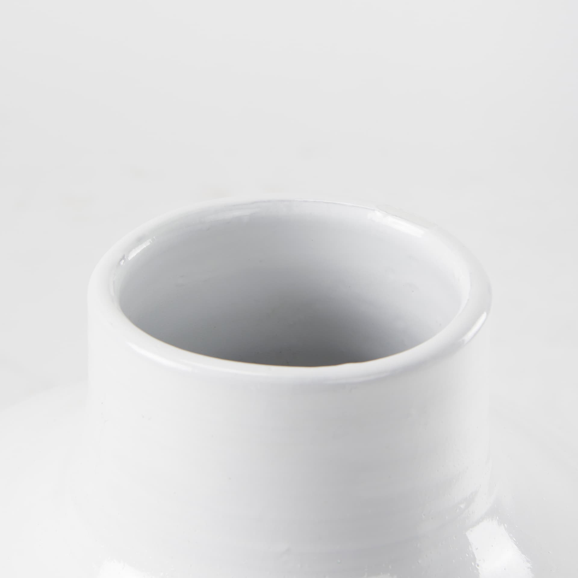 Amos 18.5L x 18.5W x 24.4H White and Dark Beige Color Blocked Ceramic Floor Vase — product photograph