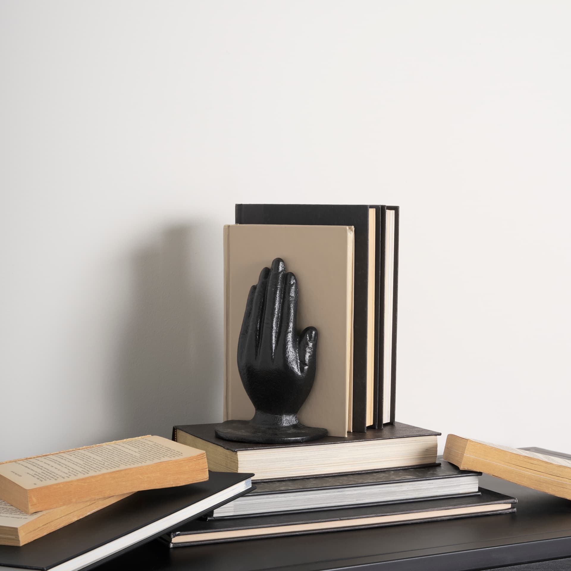 Praying Hands Bronze Cast Iron Book Ends — in a styled room