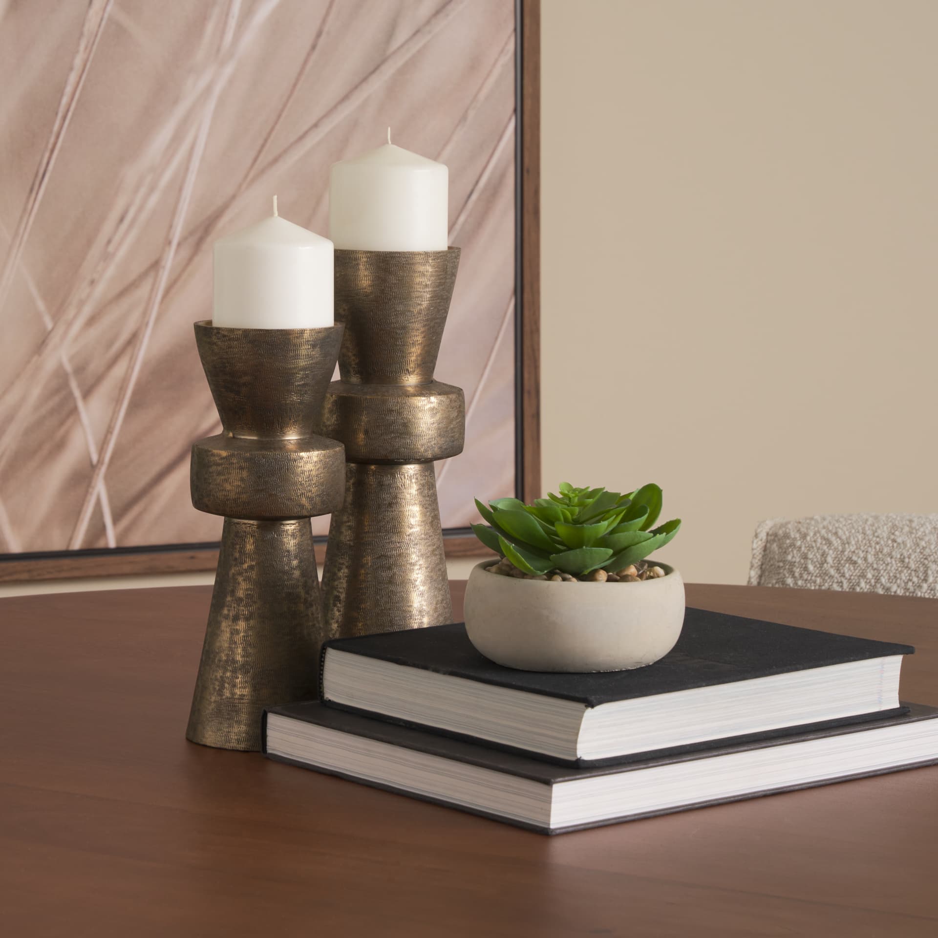 Odilia Large Textured Antiqued Gold Metal Geometric Pillar Candle Holder — in a styled room