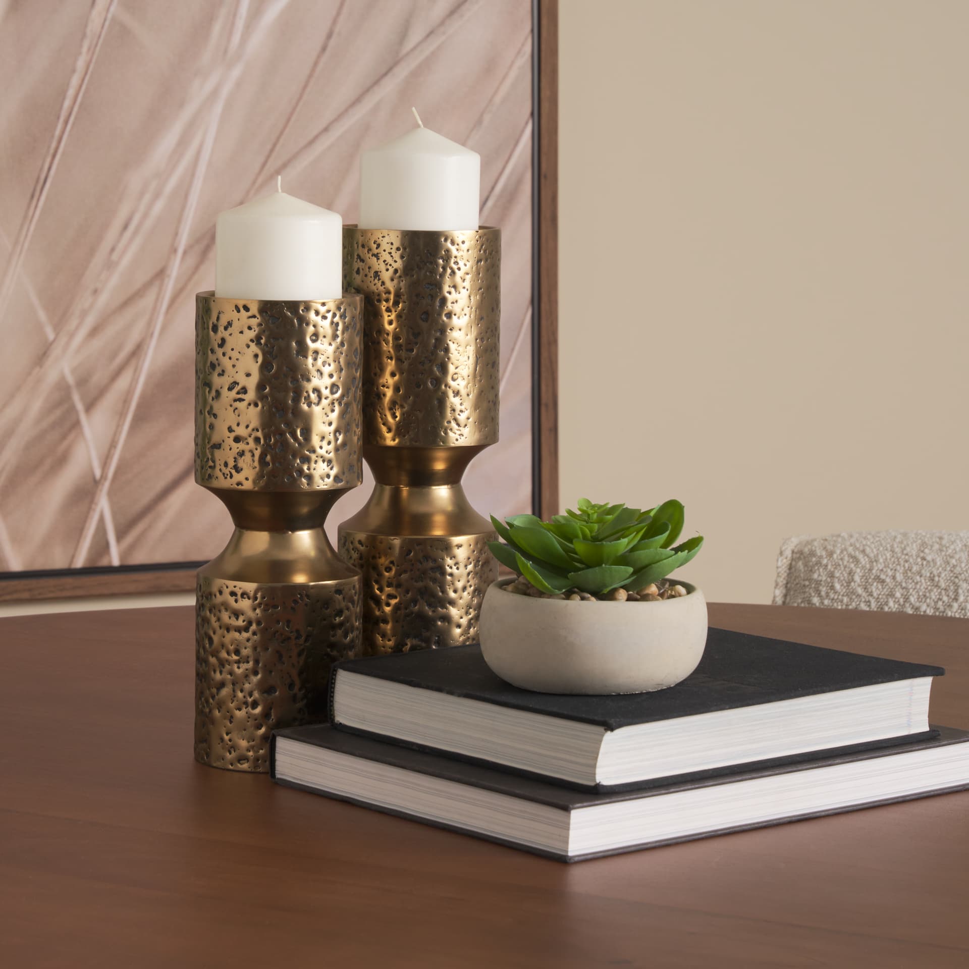 Akira Small Hammered Gold Metal Pillar Candle Holder — in a styled room