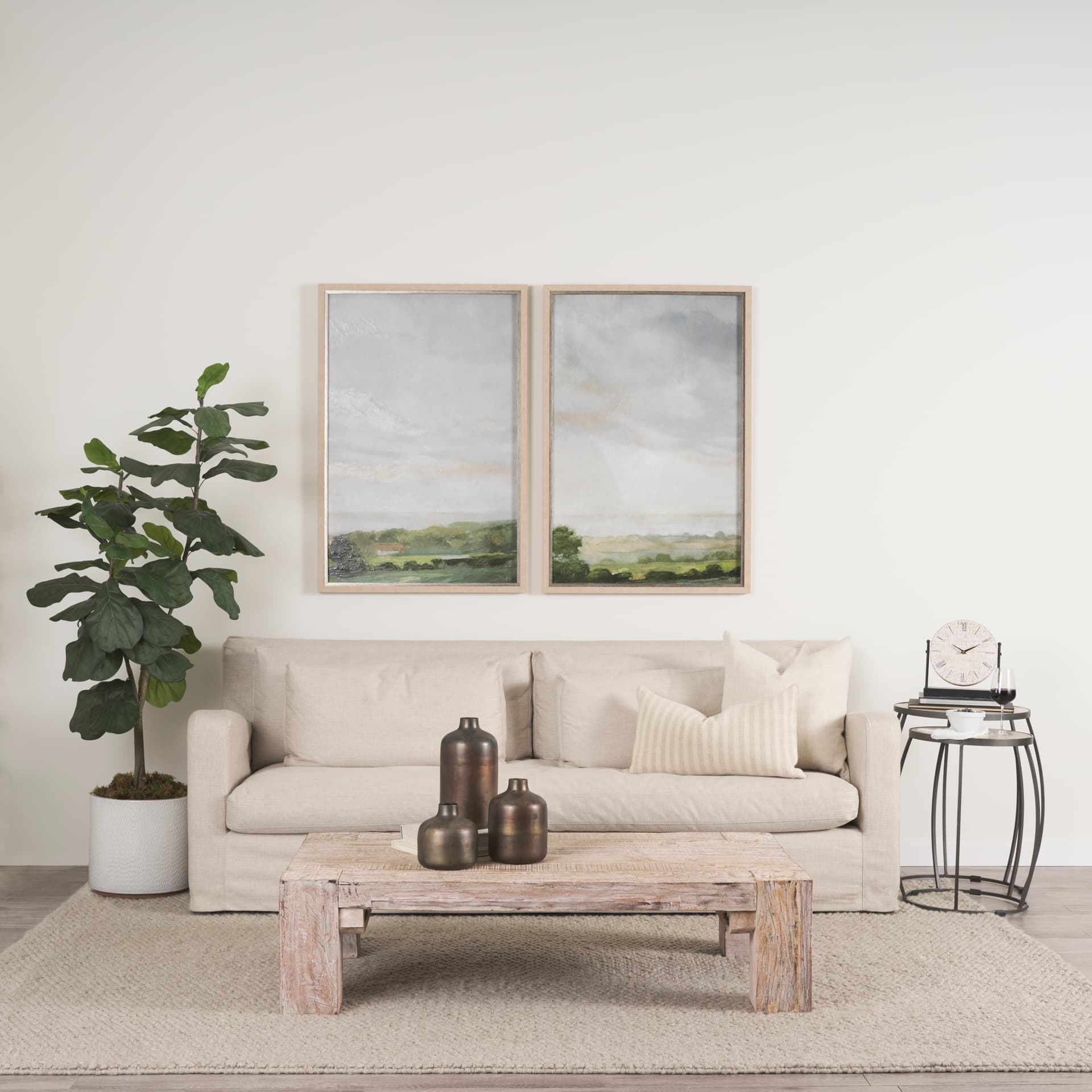 Daya Tall Antiqued Gold Metal Vase — in a styled room