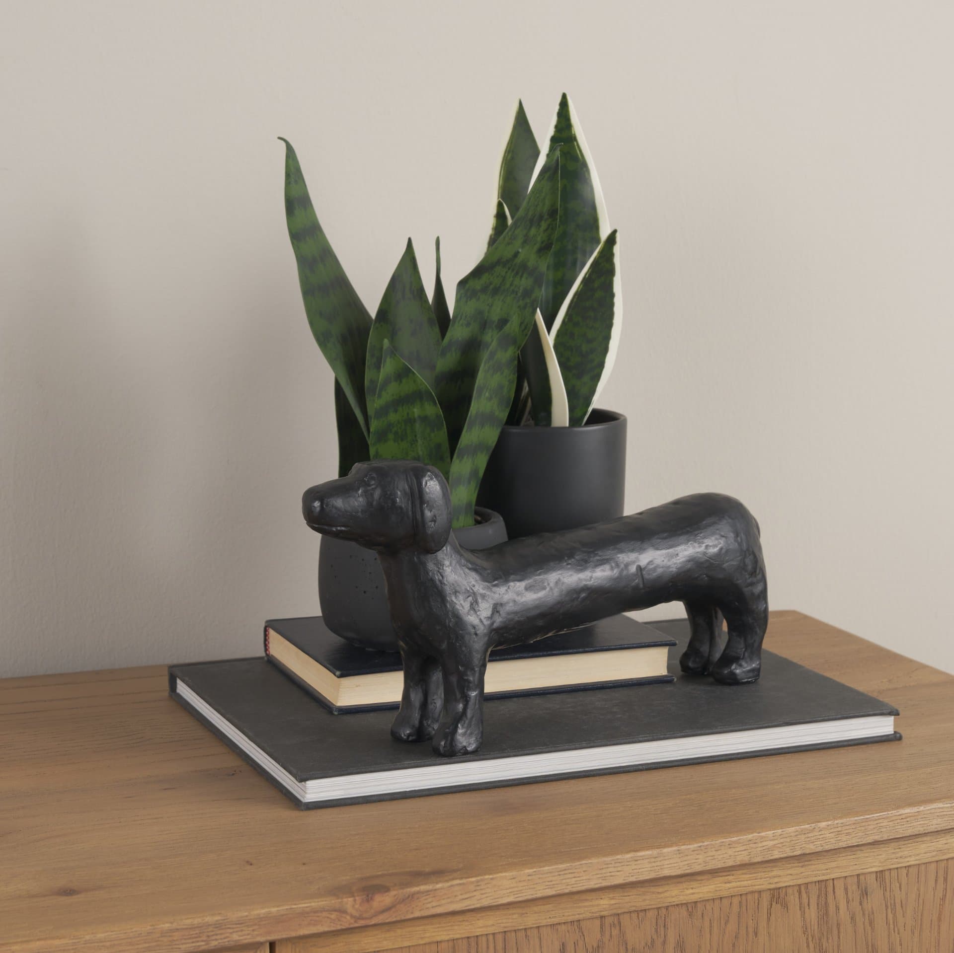 Dash Long Black Metal Dachshund Dog Object — in a styled room