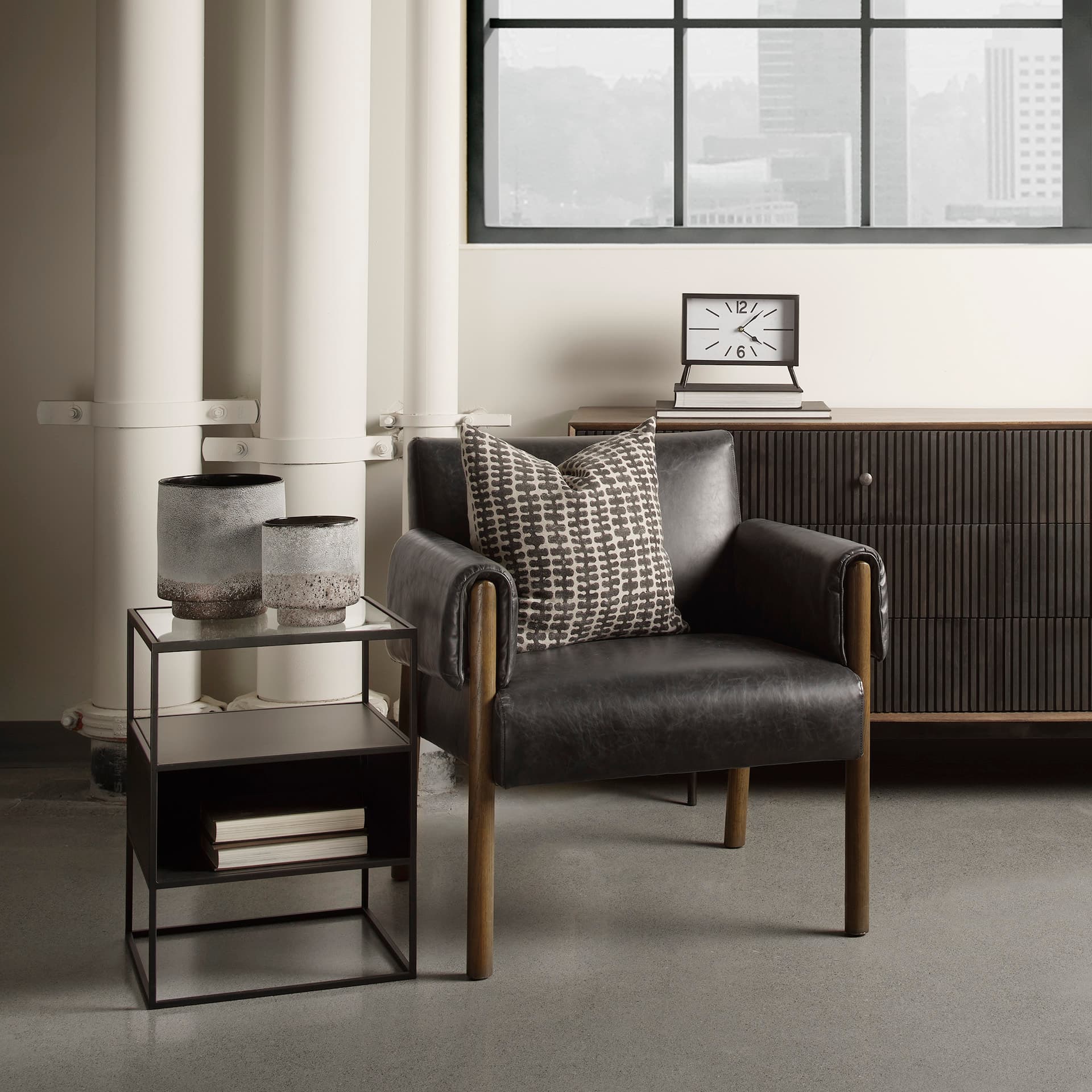 Samson 15.7L x 15.7W x 21.3H Side Table Matte Black Metal and Glass — in a styled room