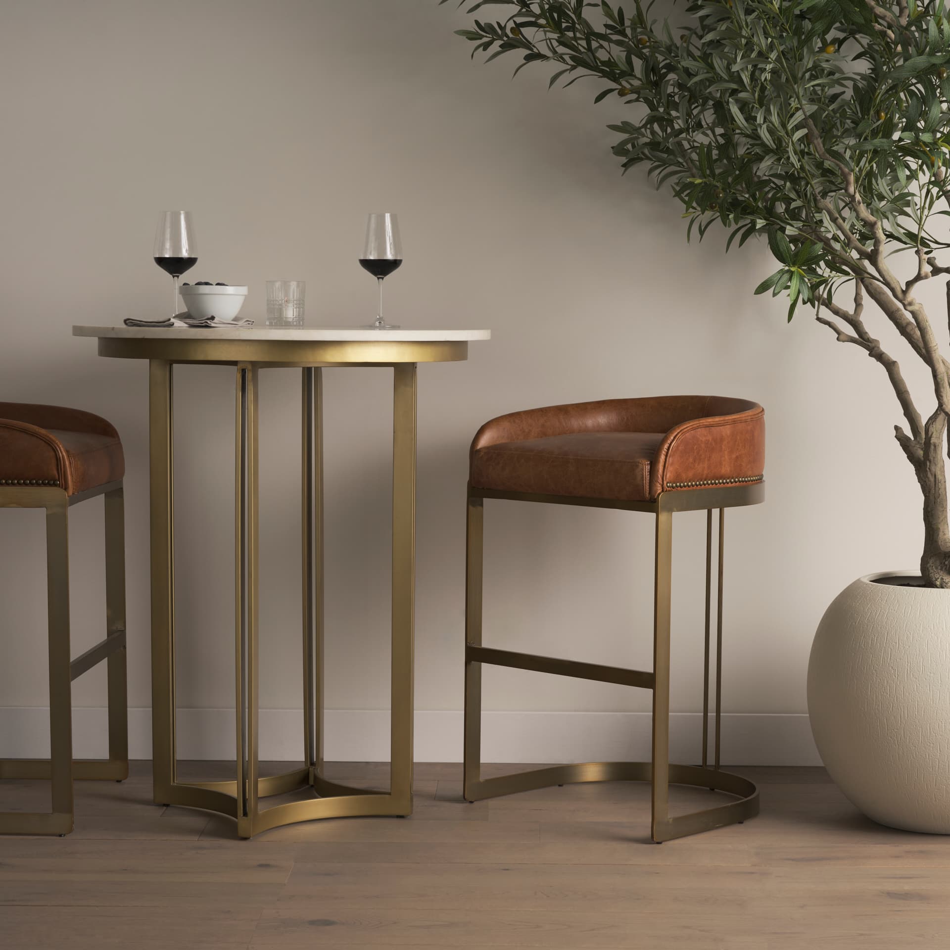 Hollyfield Low Back 28.75in Seat Bar Stool | Cognac Brown Leather — in a styled room