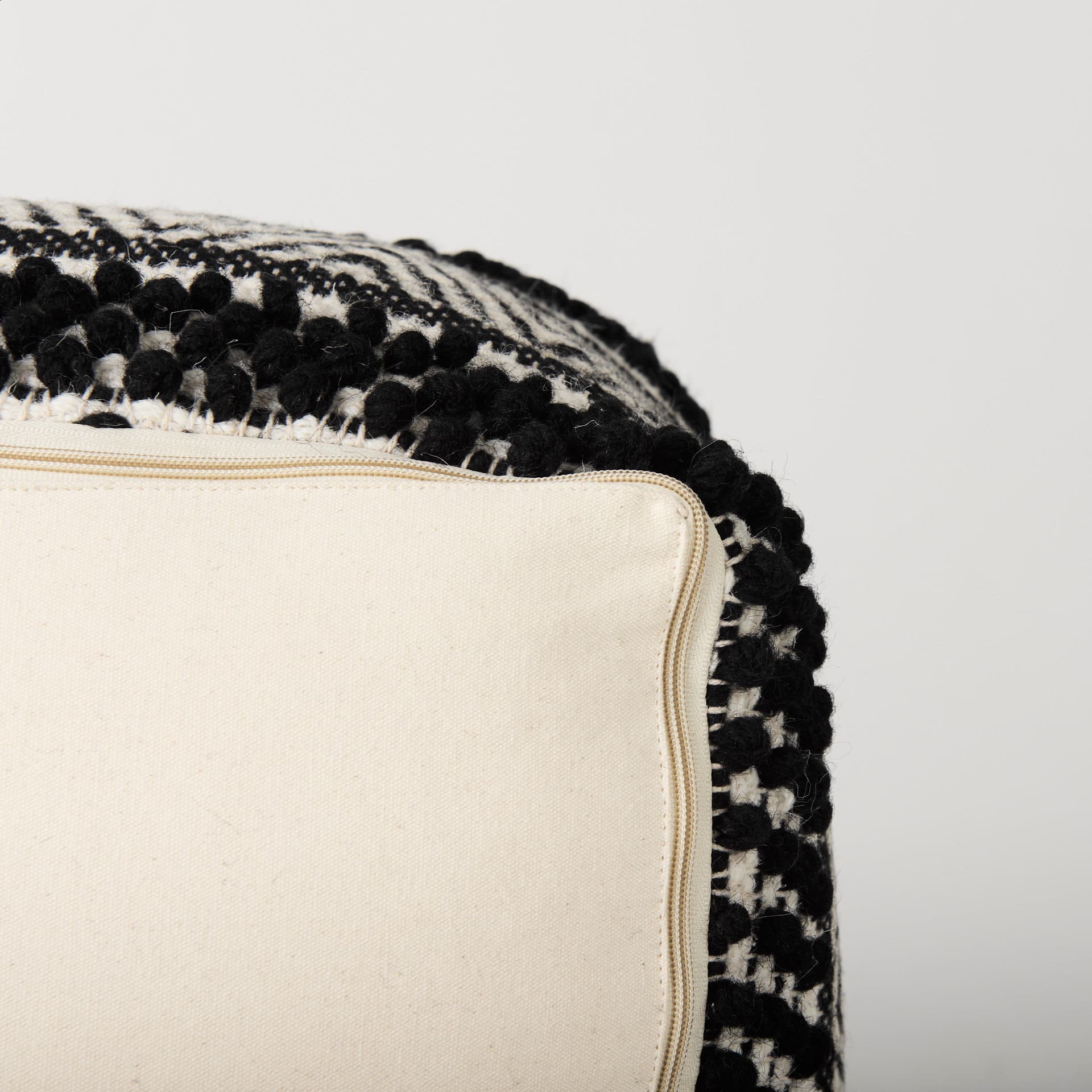 Garima 22.0L x 22.0W x 14.0H Black/White Wool and Cotton Patterned Pouf — product photograph