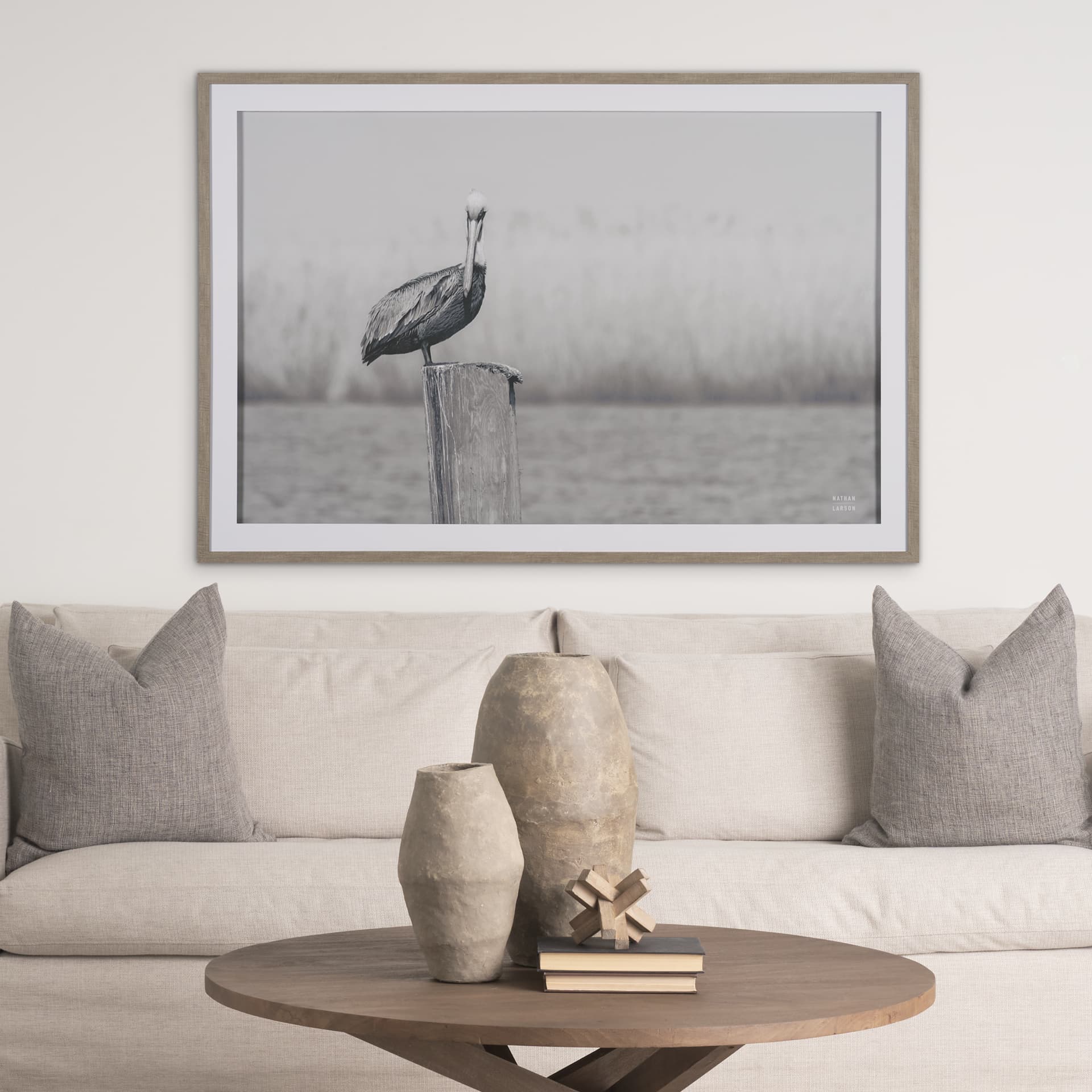 Pelican Stories by Nathan Larson Framed Art Print Matted under Glass — in a styled room