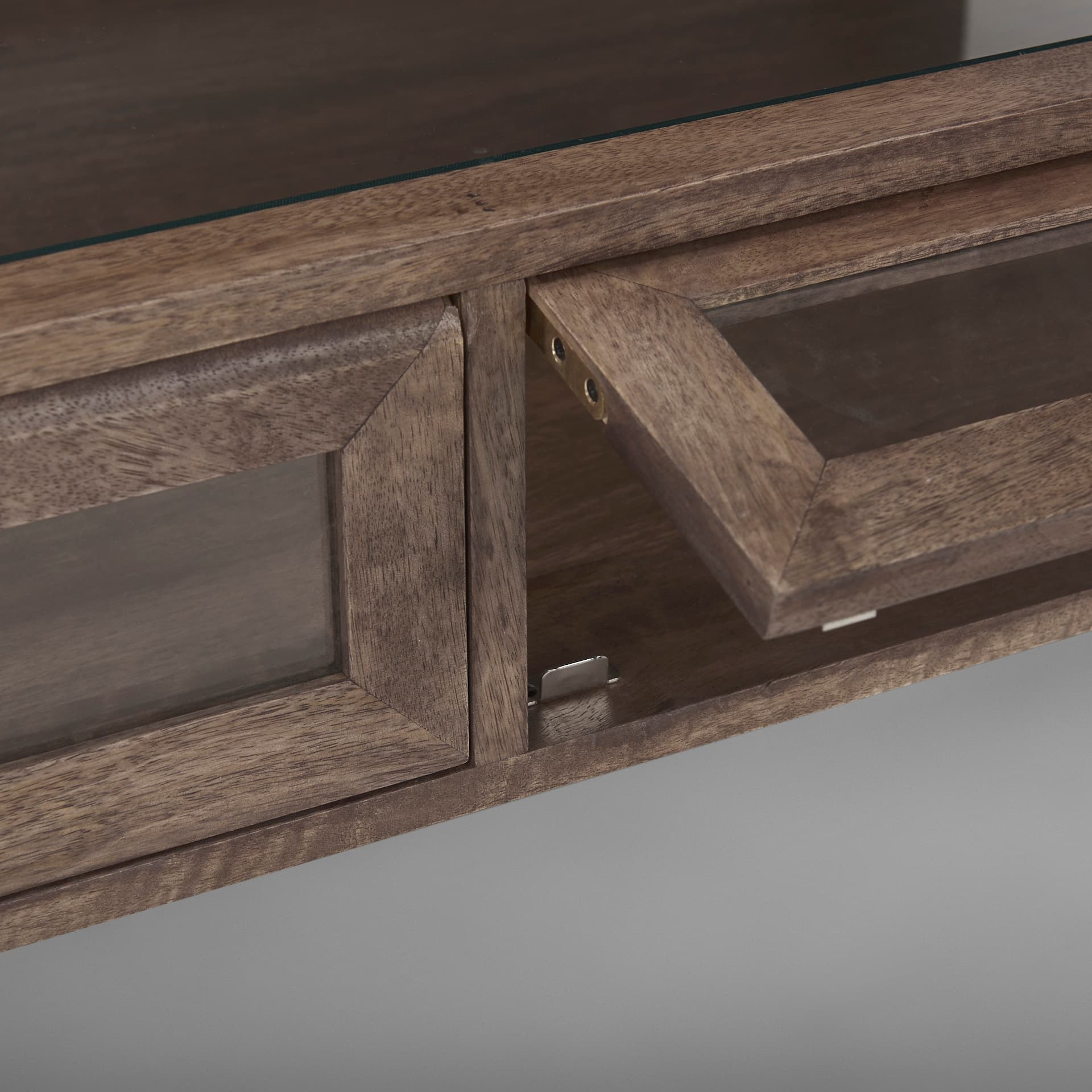 Arelius 49.5"L Rectangular Glass-Top Medium Brown Wood w/ Black Metal Base Display Coffee Table — product photograph