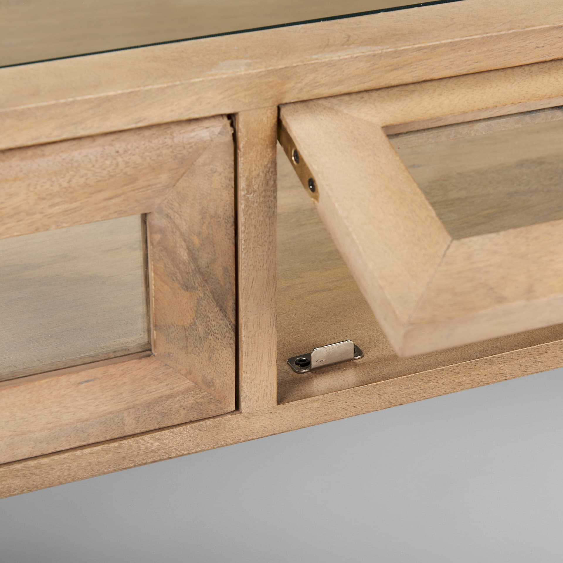Arelius 49.5"L Rectangular Light Brown Wood w/ Black Metal Base Display Coffee Table — product photograph