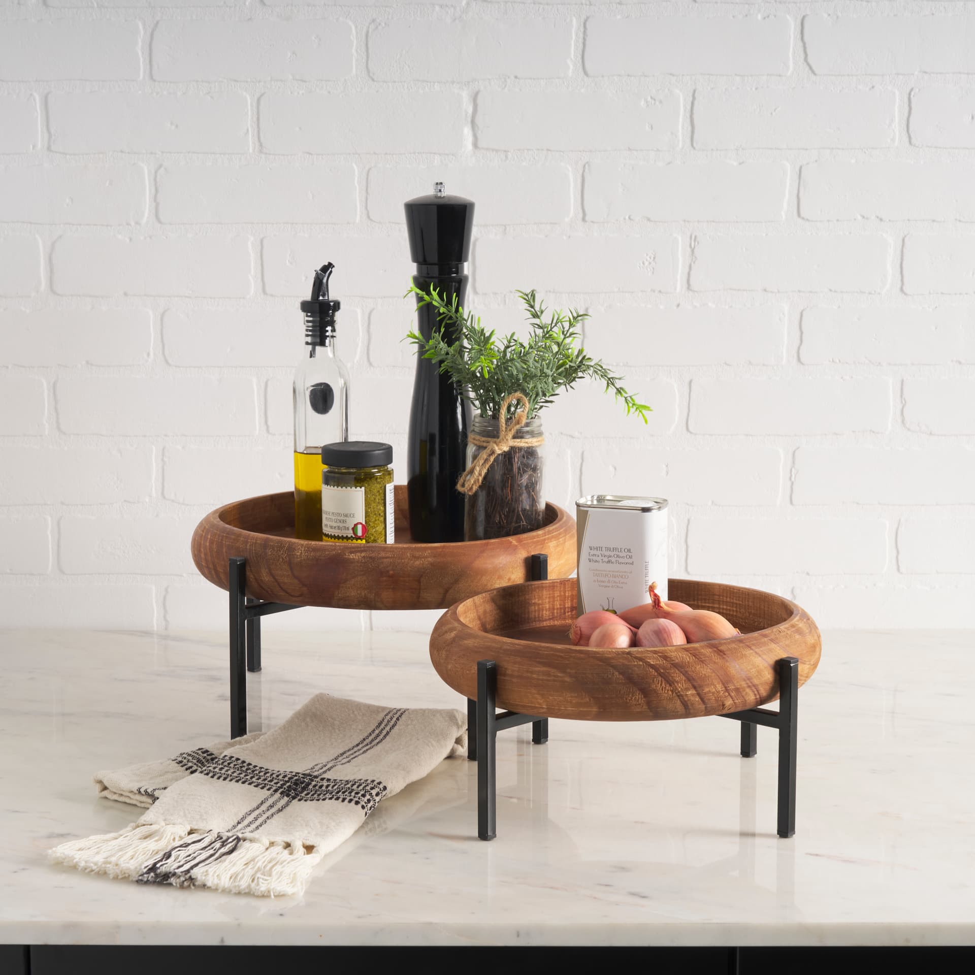 Wally Round Medium Brown Wood w/ Matte Black Metal Stand Trays — in a styled room