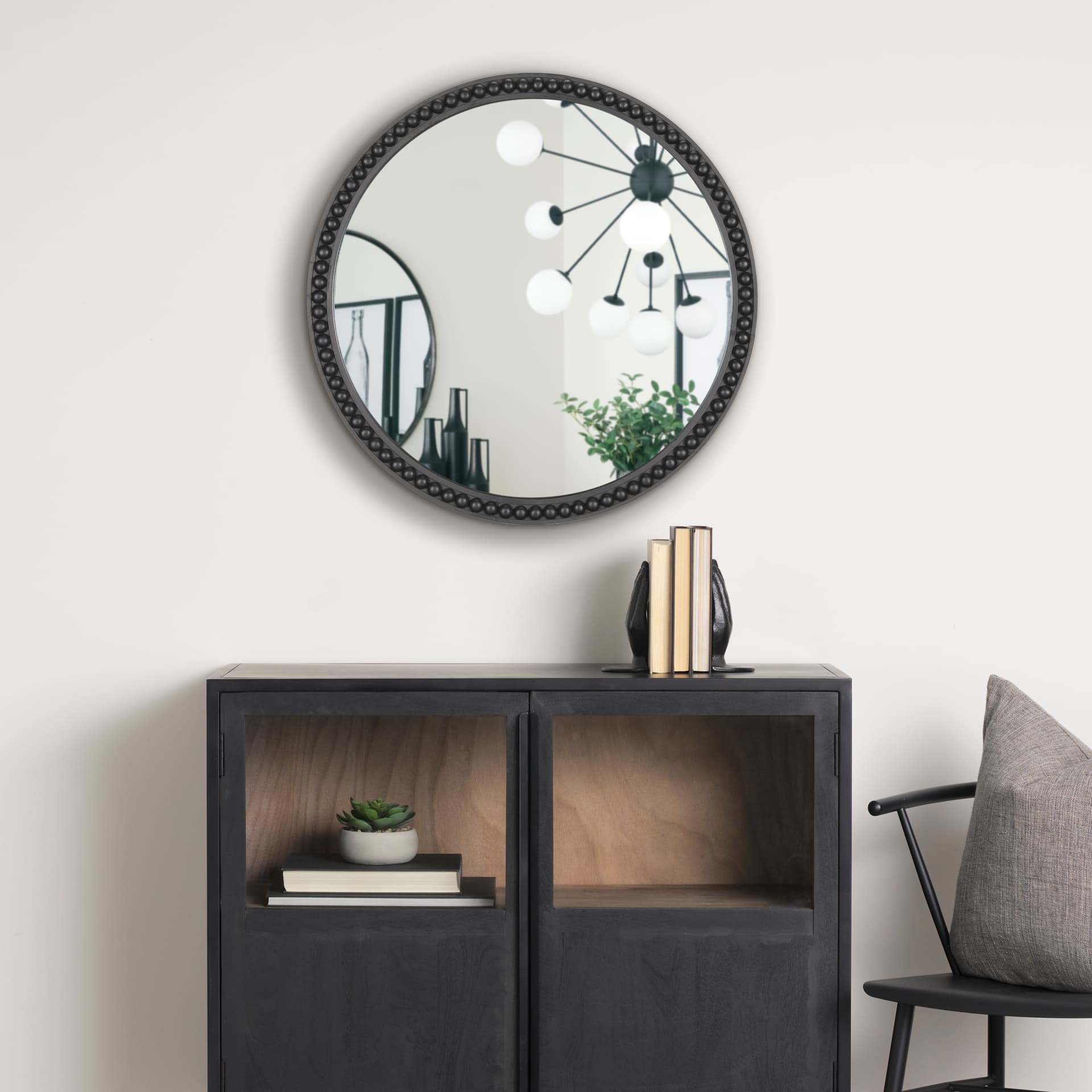 Roan Black Wood Beaded Wall Mirror — in a styled room