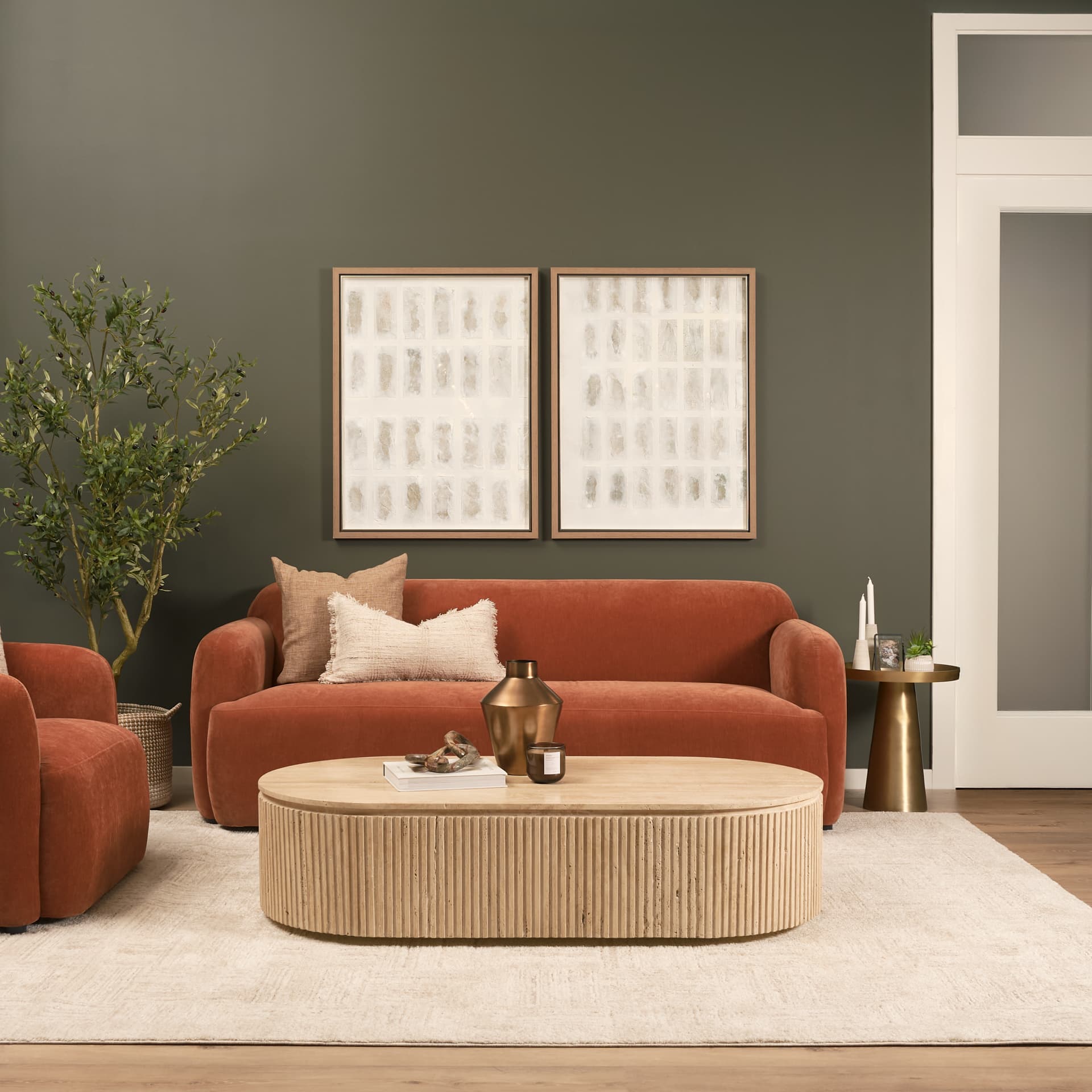 Elara Ribbed Oblong Travertine Coffee Table — in a styled room