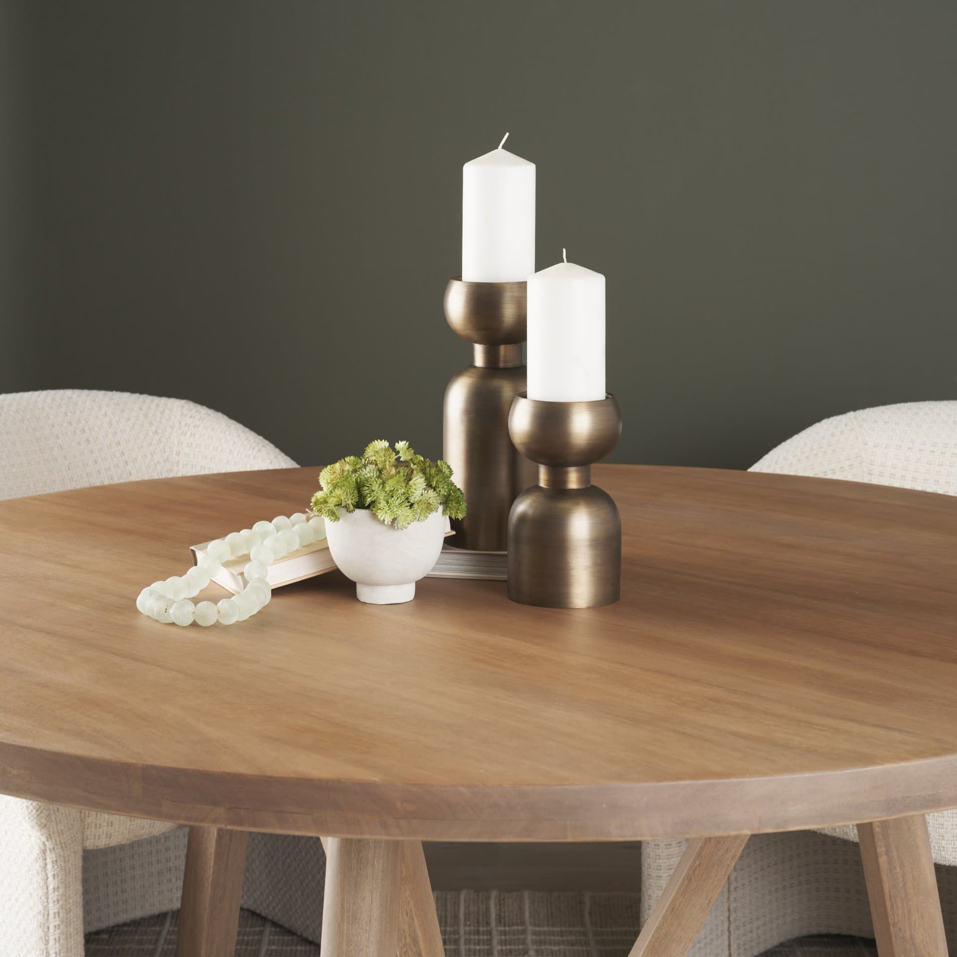 Pelar Large Antiqued Brass Stacked Pillar Candle Holder — in a styled room