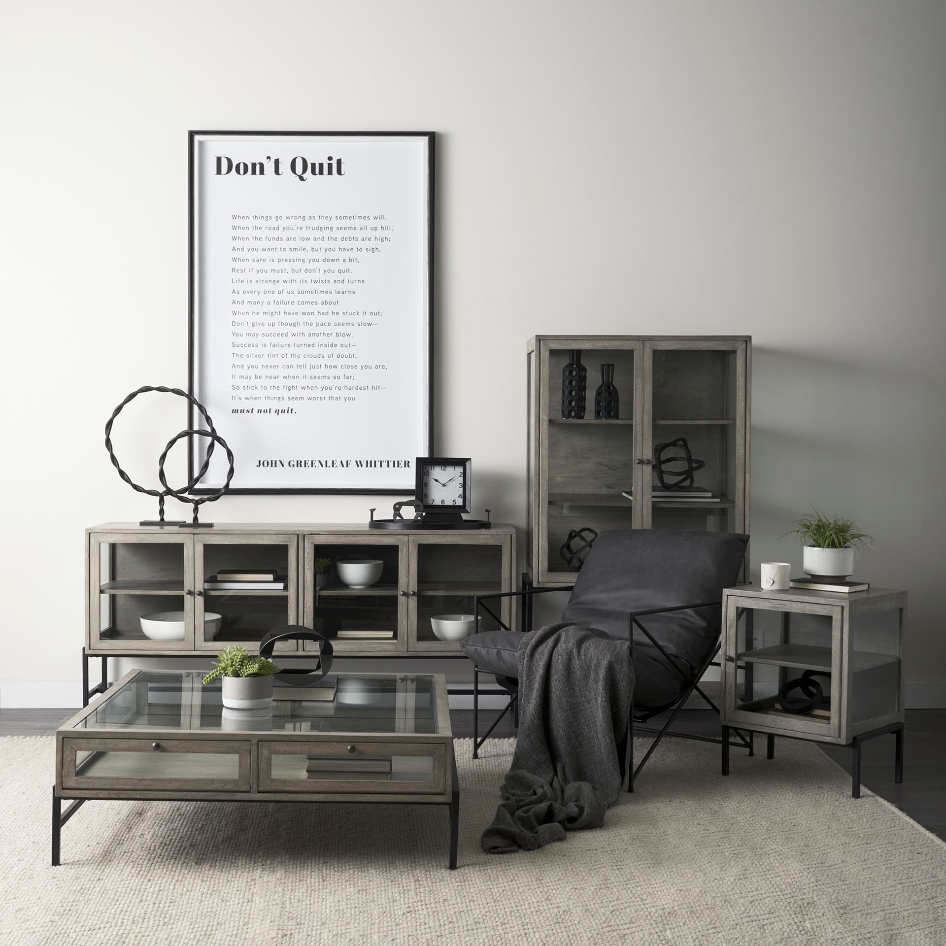 Arelius 42" Square Glass-Top Gray Wood w/ Black Metal Base Display Coffee Table — in a styled room
